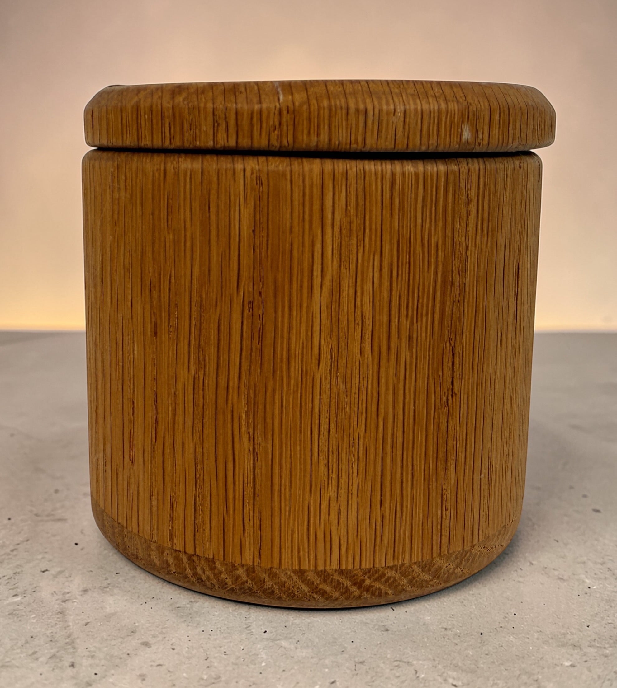 Vintage oak salt cellar with turned wood construction and minimalist design. Functional lidded kitchen container ideal for salt, spices, or countertop storage.
