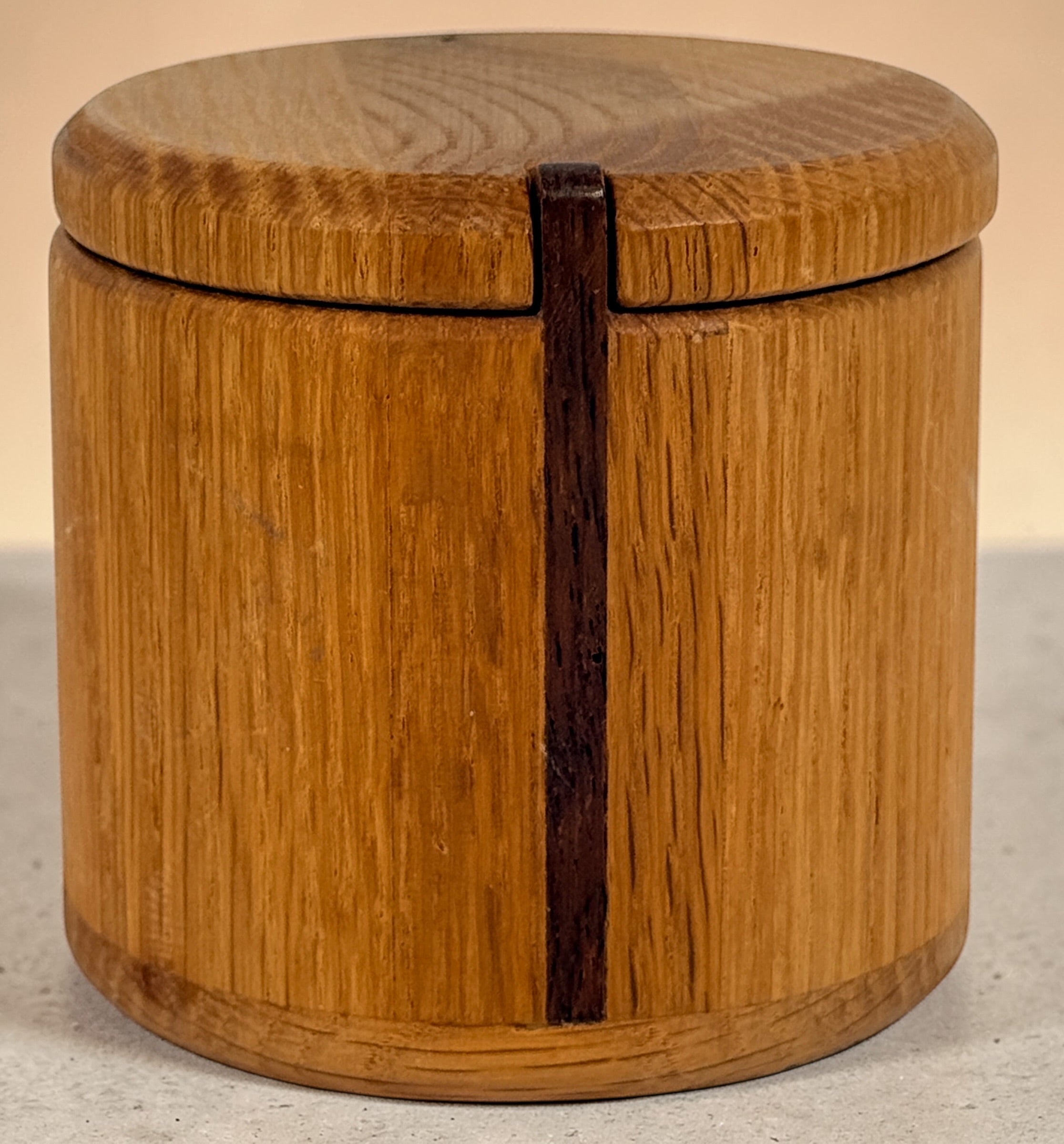 Vintage oak salt cellar with turned wood construction and minimalist design. Functional lidded kitchen container ideal for salt, spices, or countertop storage.