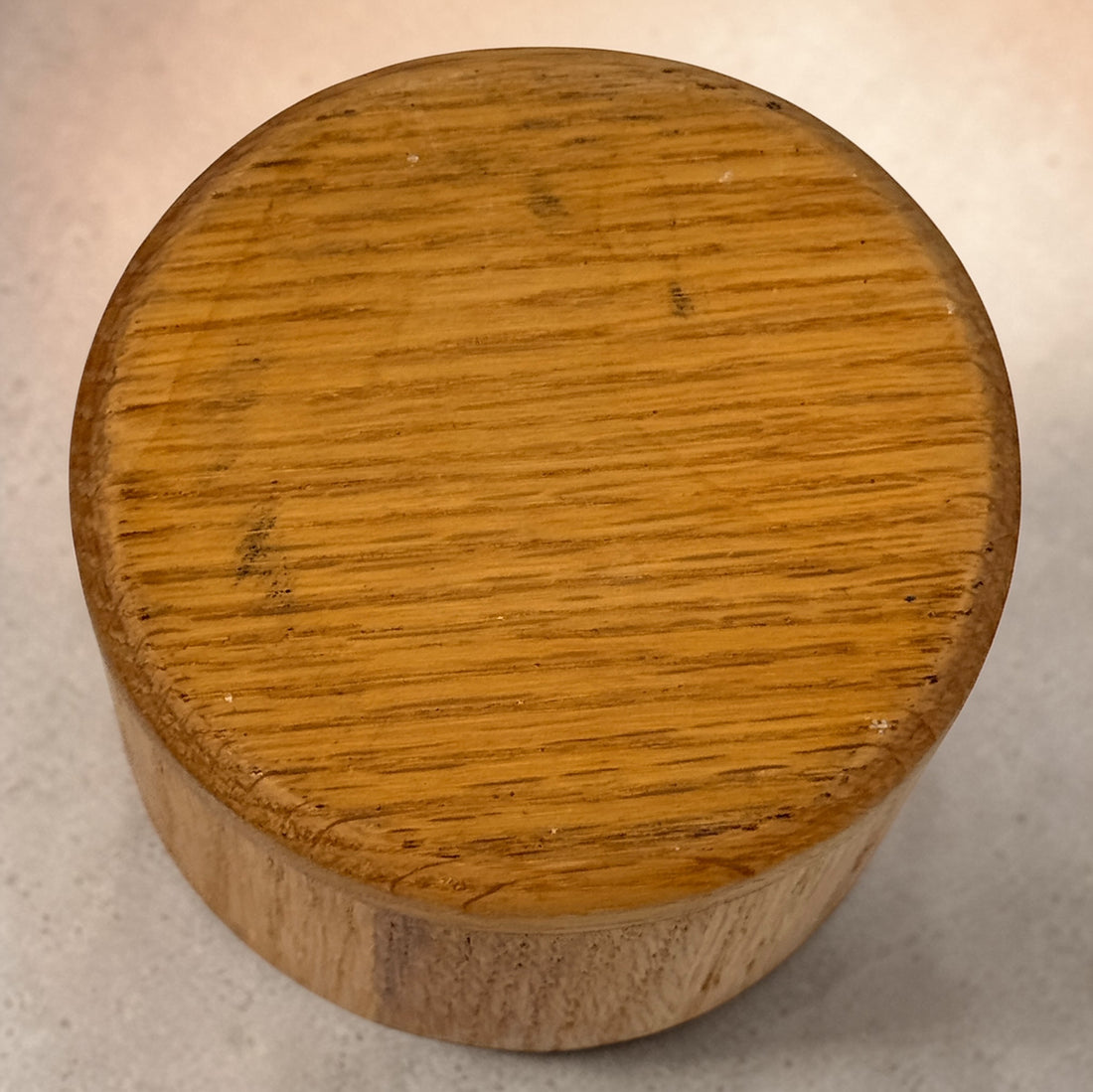 Vintage oak salt cellar with turned wood construction and minimalist design. Functional lidded kitchen container ideal for salt, spices, or countertop storage.