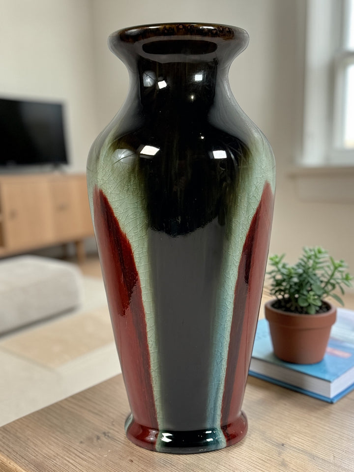 Vintage mid century studio pottery vase with bold red, black and green drip glaze. Decorative ceramic statement piece with crackle finish and modern appeal.