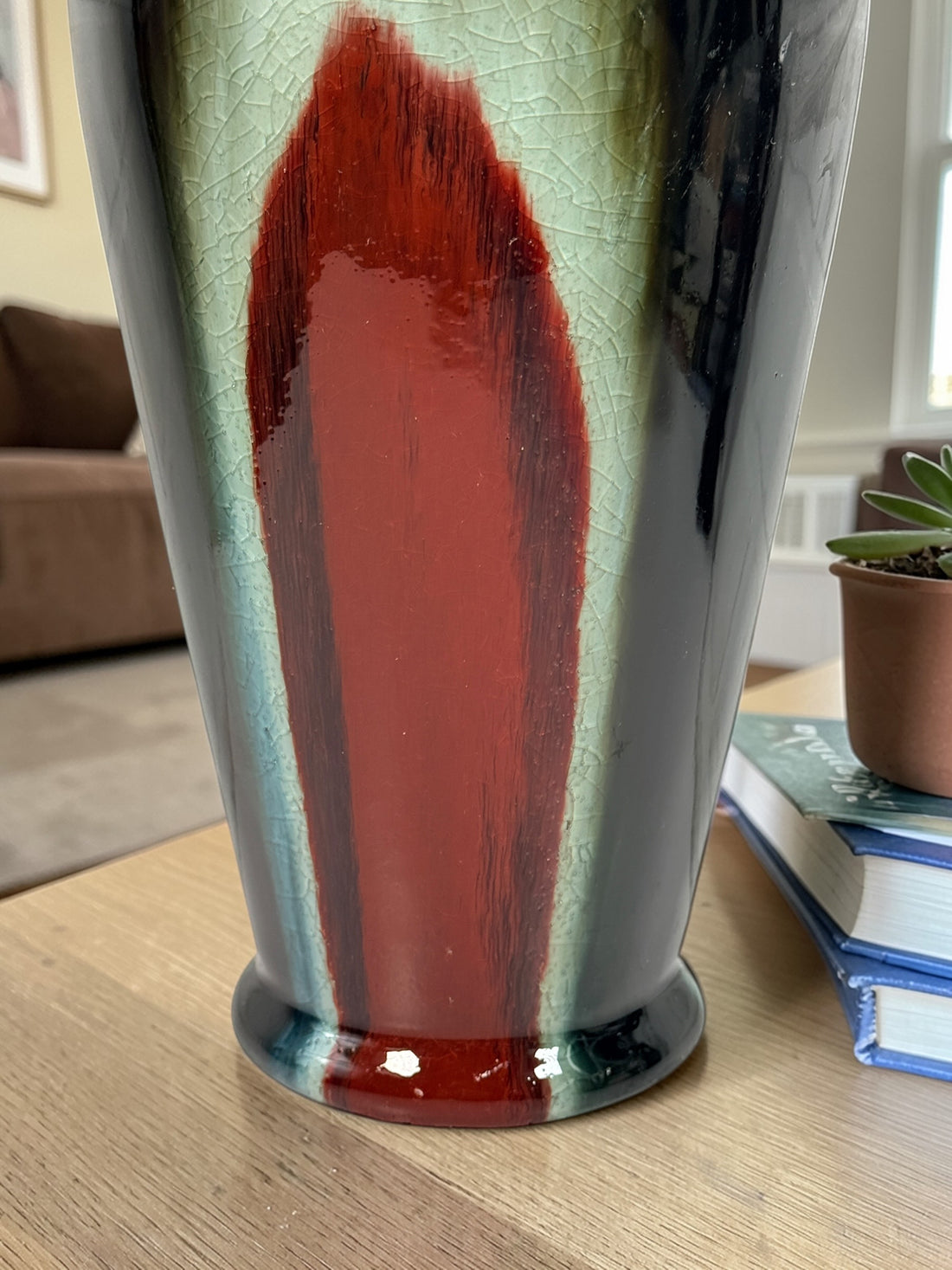 Vintage mid century studio pottery vase with bold red, black and green drip glaze. Decorative ceramic statement piece with crackle finish and modern appeal.