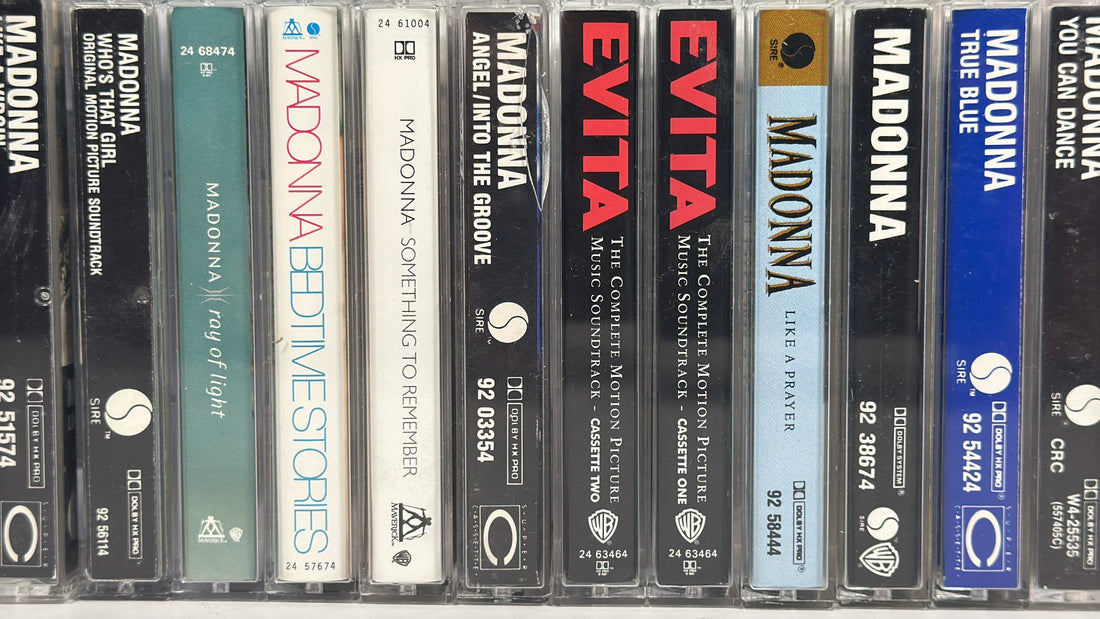 Vintage Madonna cassette tape lot featuring 12 albums from the 80s and 90s including Like a Virgin, True Blue, and Ray of Light, complete with cases.