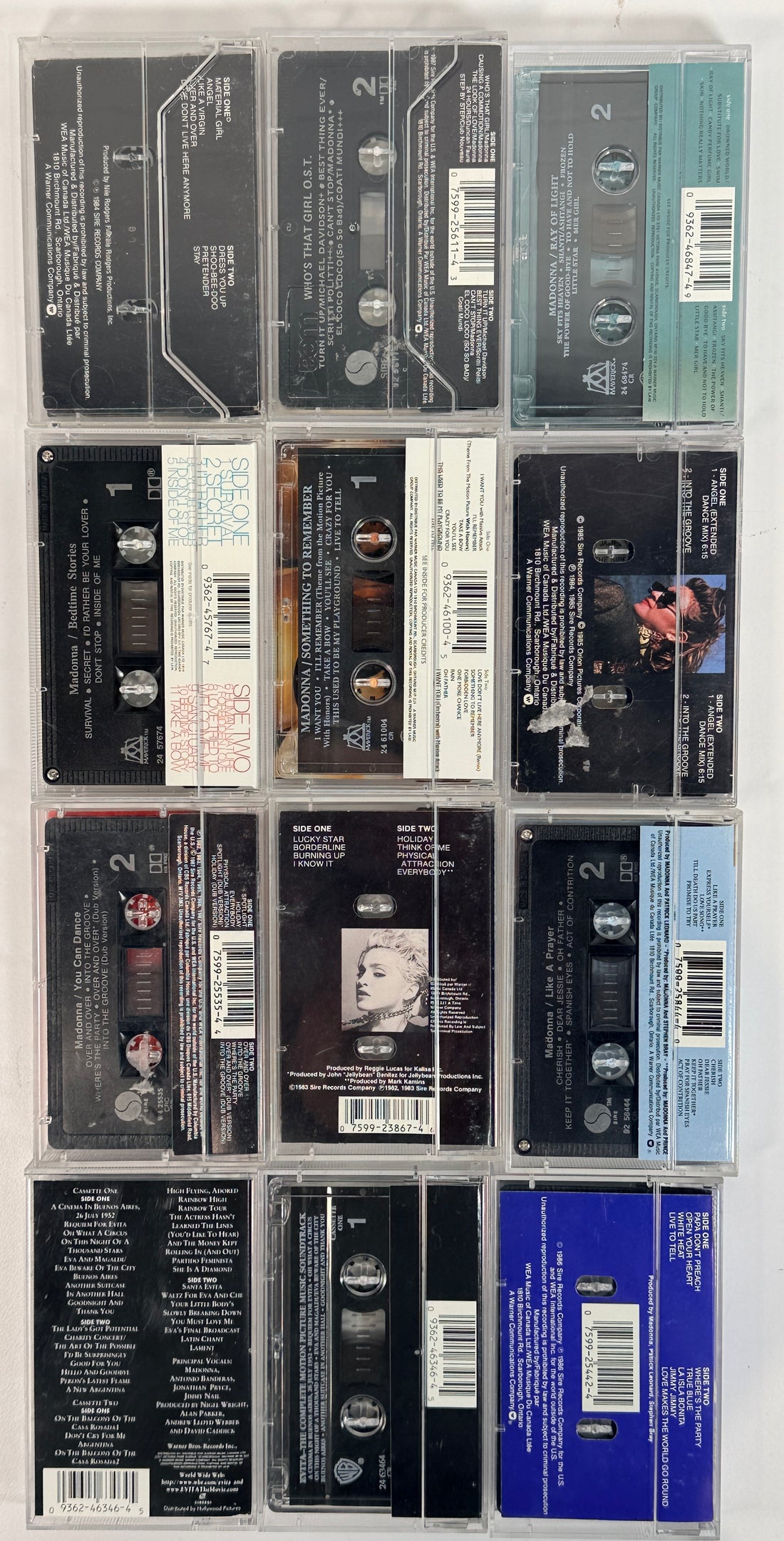Vintage Madonna cassette tape lot featuring 12 albums from the 80s and 90s including Like a Virgin, True Blue, and Ray of Light, complete with cases.