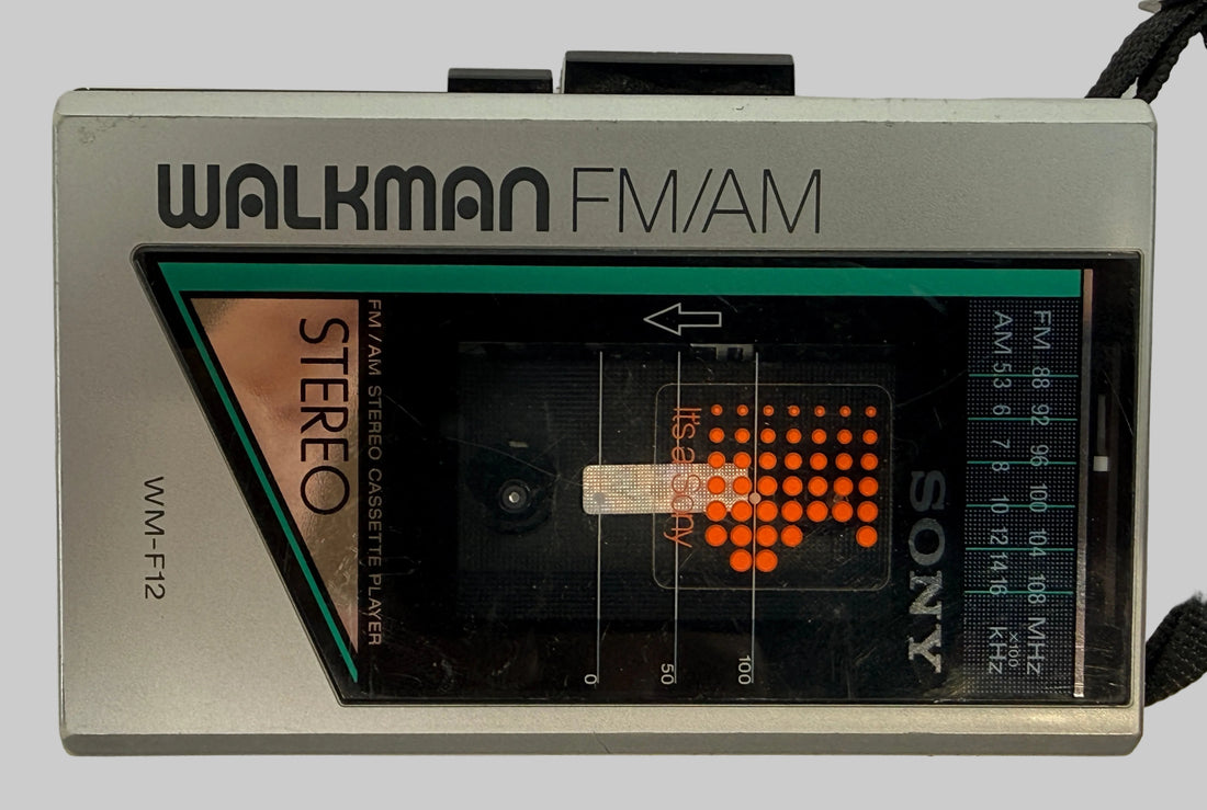 Vintage Sony Walkman WM-F12 cassette player with AM/FM radio. Classic 1980s portable audio unit with iconic design, ideal for collectors or restoration.