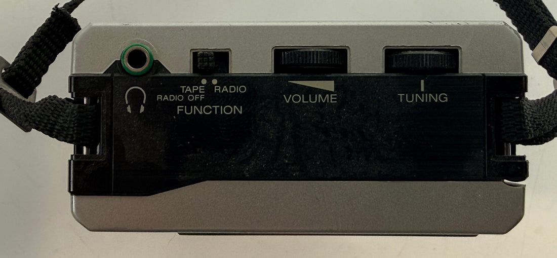 Vintage Sony Walkman WM-F12 cassette player with AM/FM radio. Classic 1980s portable audio unit with iconic design, ideal for collectors or restoration.