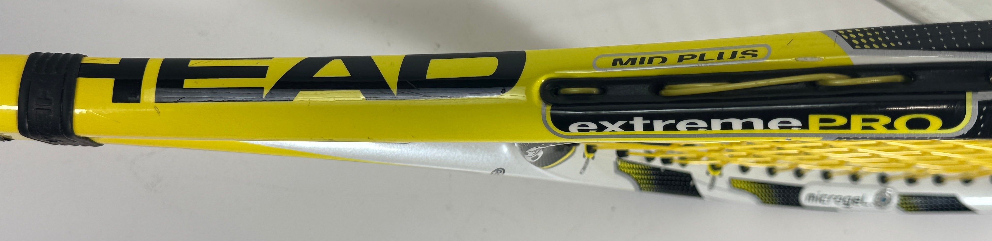 HEAD MicroGel Radical tennis racquet, used player frame with mid-plus head size. Affordable performance racquet with heavy wear, ideal for practice or backup use.