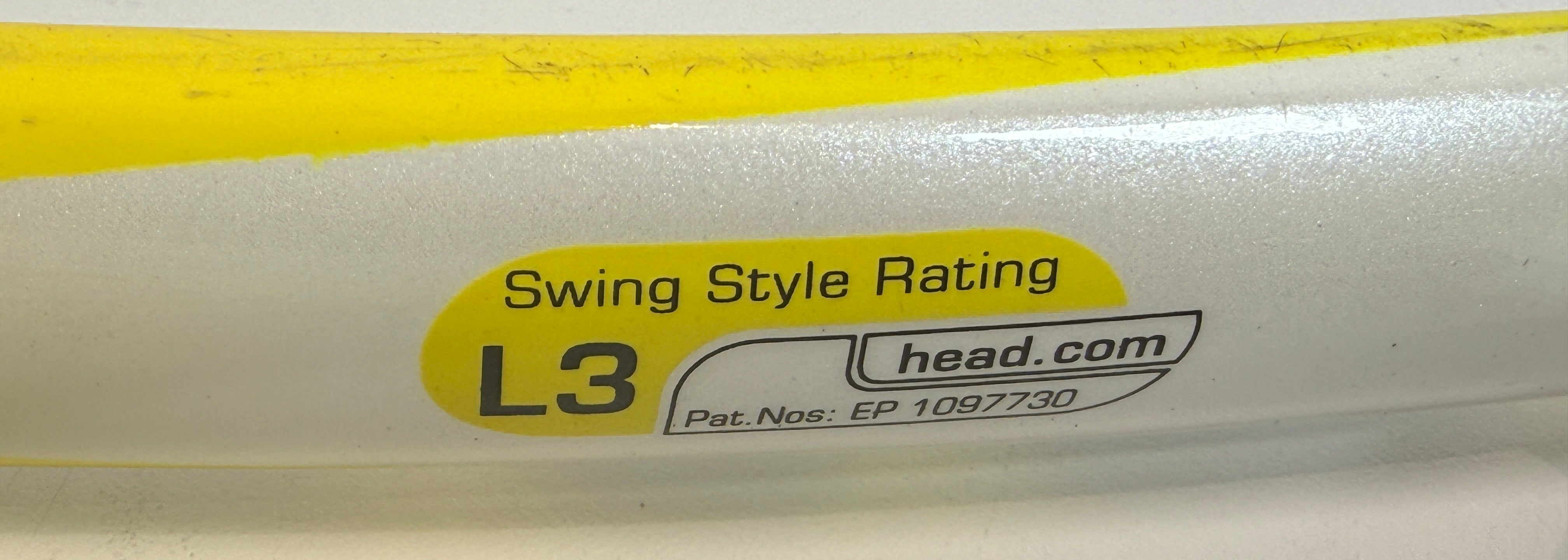 HEAD MicroGel Radical tennis racquet, used player frame with mid-plus head size. Affordable performance racquet with heavy wear, ideal for practice or backup use.