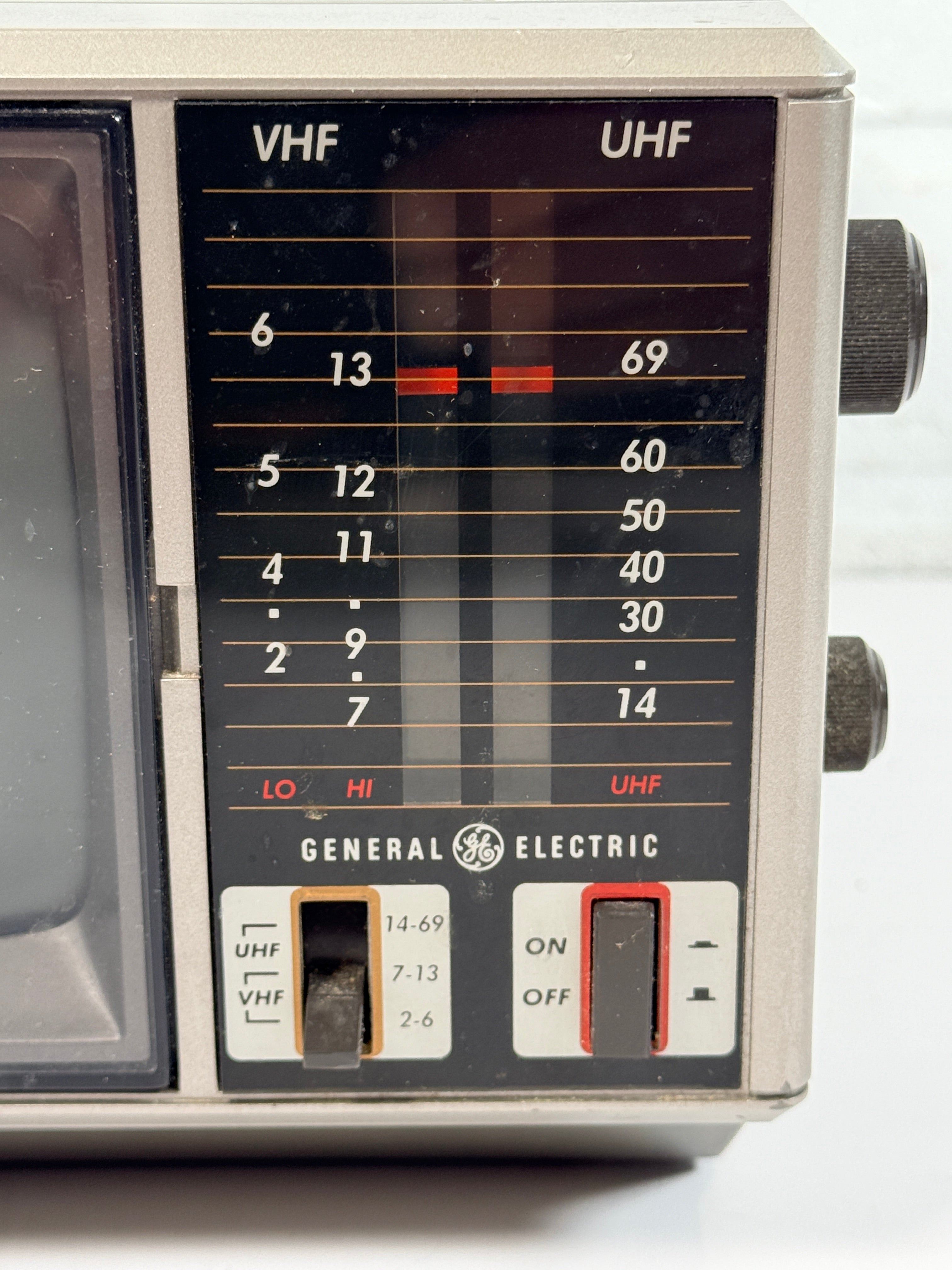 Vintage GE Spacemaker portable TV from 1986, compact black &amp; white CRT with VHF/UHF tuning. Retro electronics piece perfect for display or collection.