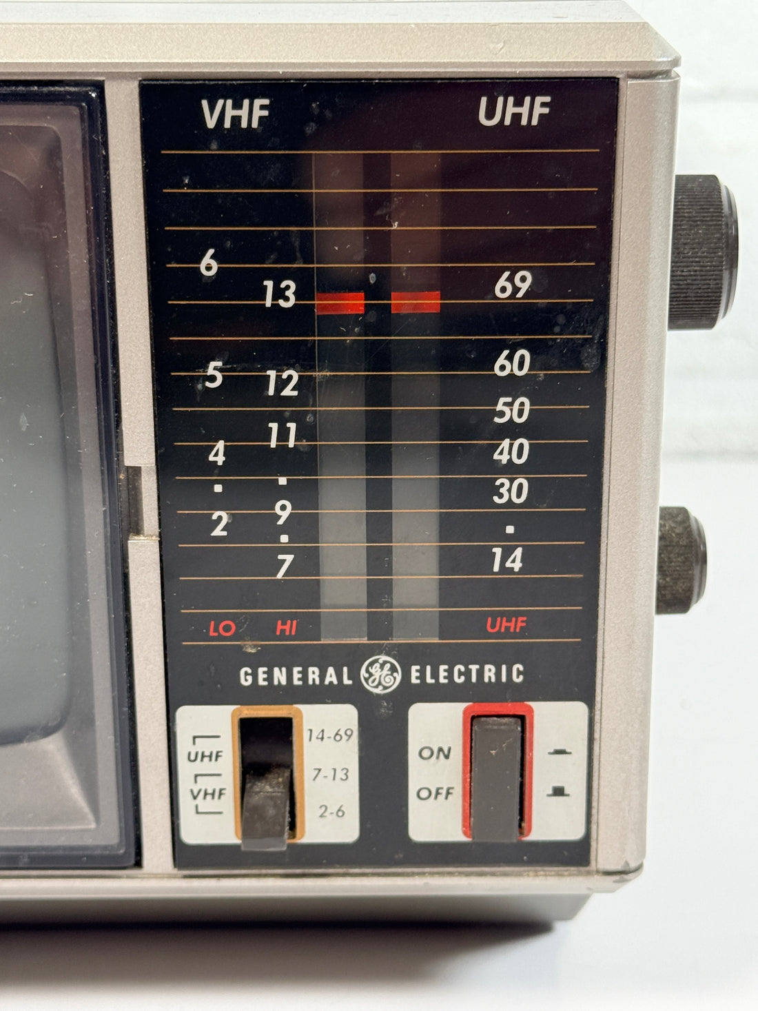 Vintage GE Spacemaker portable TV from 1986, compact black &amp; white CRT with VHF/UHF tuning. Retro electronics piece perfect for display or collection.