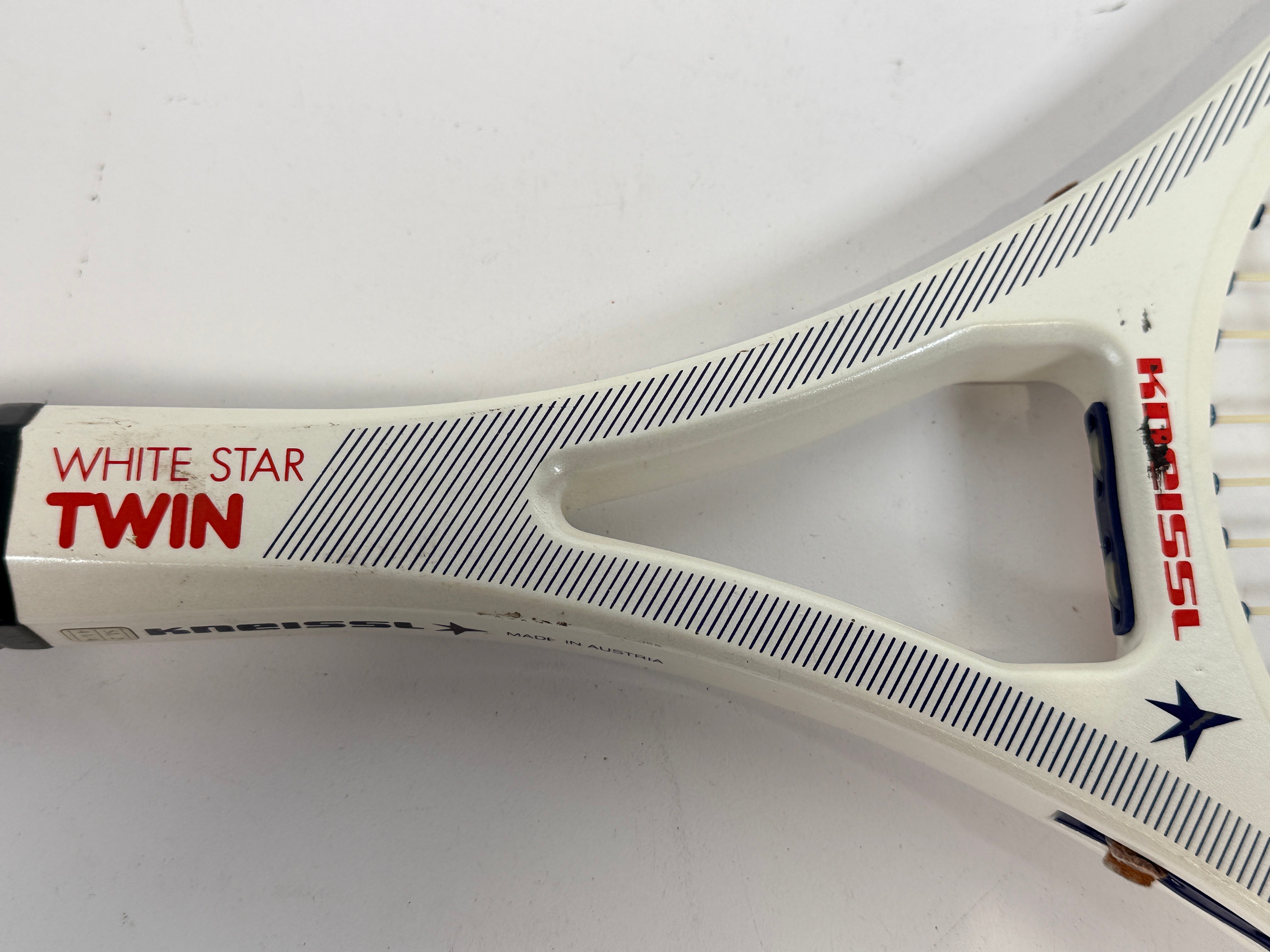 Vintage Kneissl White Star Twin tennis racquet made in Austria. Classic 1970s–80s graphite frame with leather grip. Great for display or restoration.