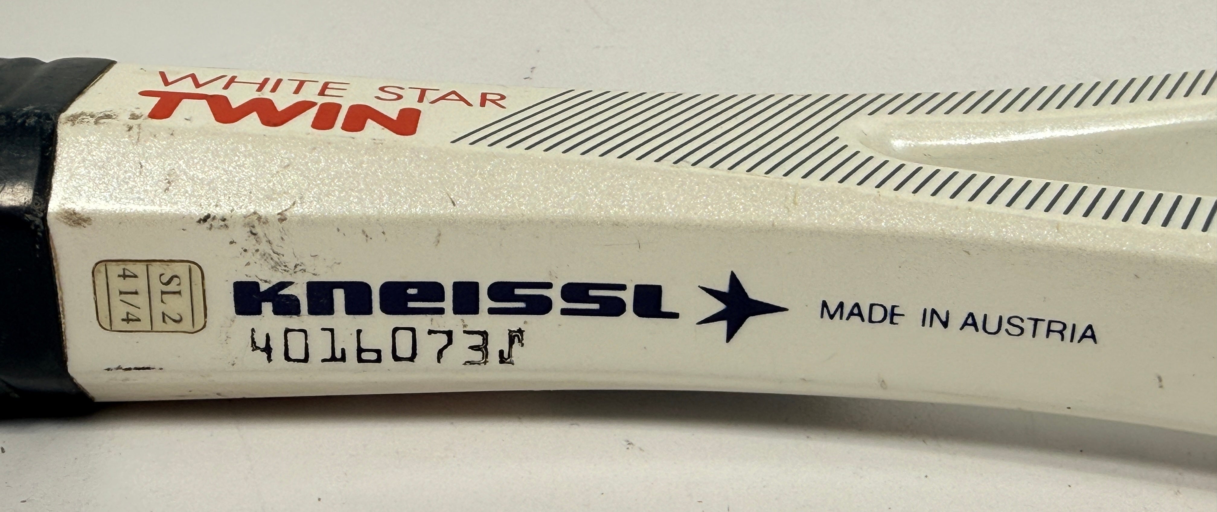 Vintage Kneissl White Star Twin tennis racquet made in Austria. Classic 1970s–80s graphite frame with leather grip. Great for display or restoration.