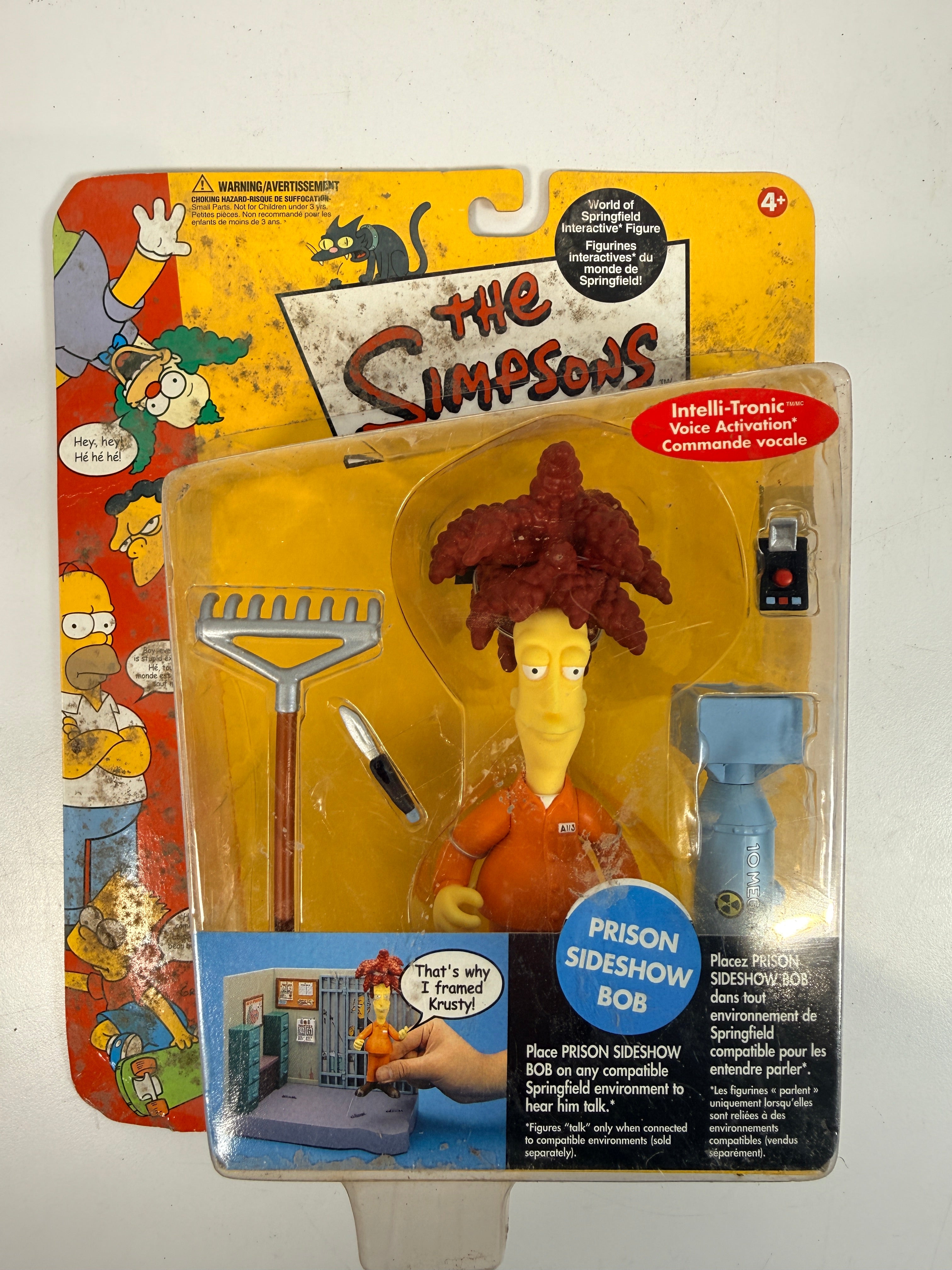 The Simpsons Prison Sideshow Bob sealed Playmates World of Springfield figure with accessories. Vintage collectible action figure carded toy.
