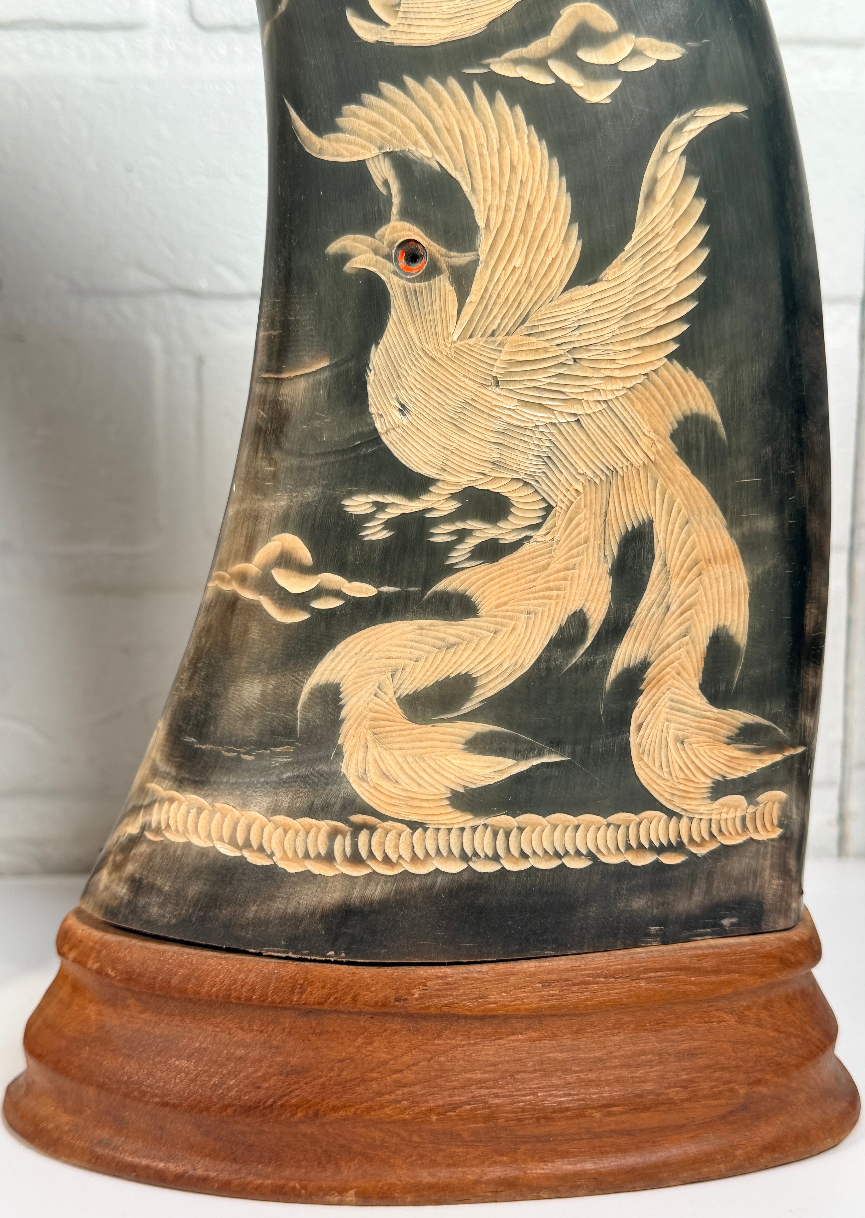Vintage pair buffalo horn dragon phoenix statues on hardwood bases. Hand carved Asian décor sculptures with dramatic natural horn shape and collectible appeal.