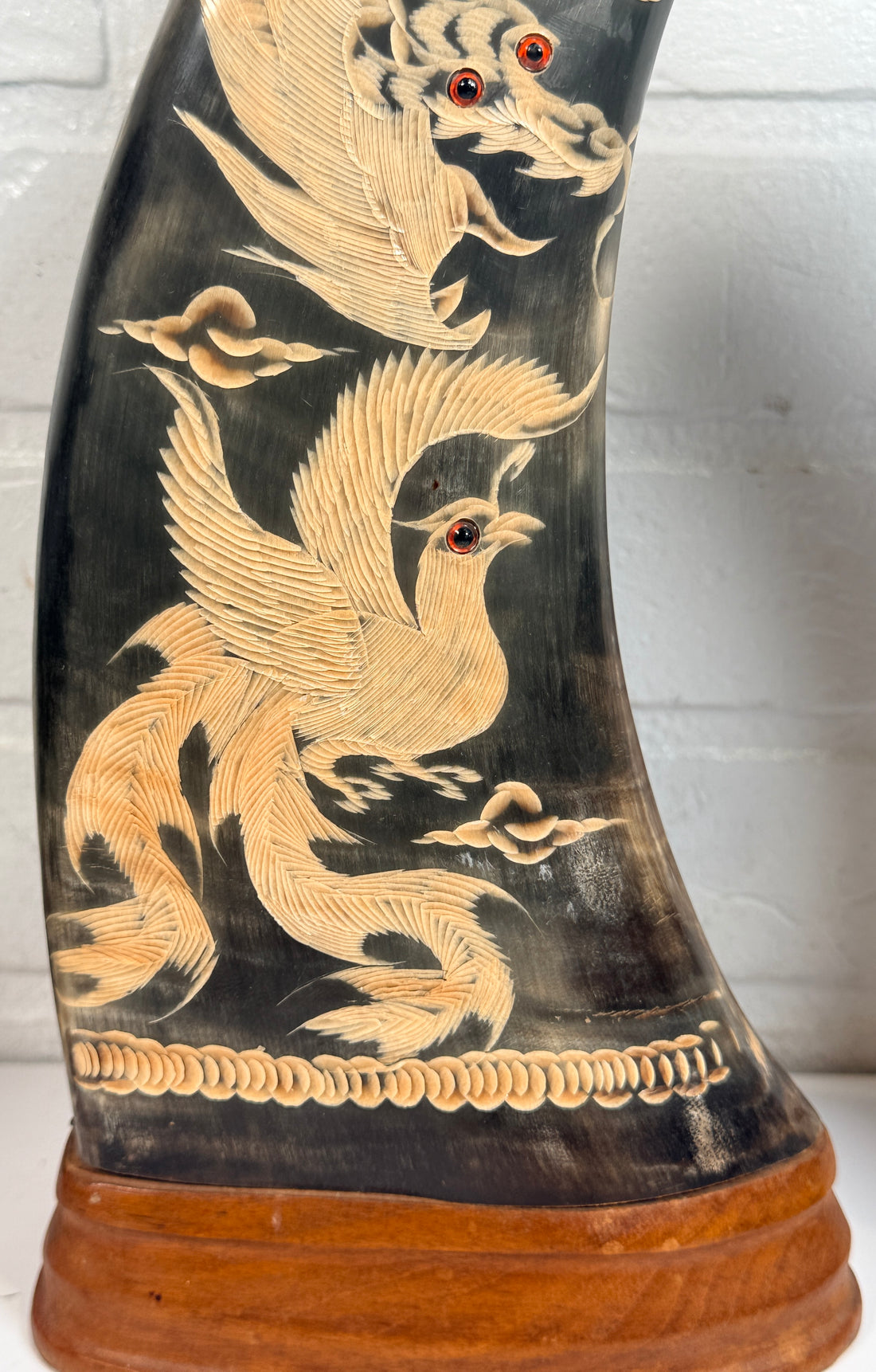 Vintage pair buffalo horn dragon phoenix statues on hardwood bases. Hand carved Asian décor sculptures with dramatic natural horn shape and collectible appeal.