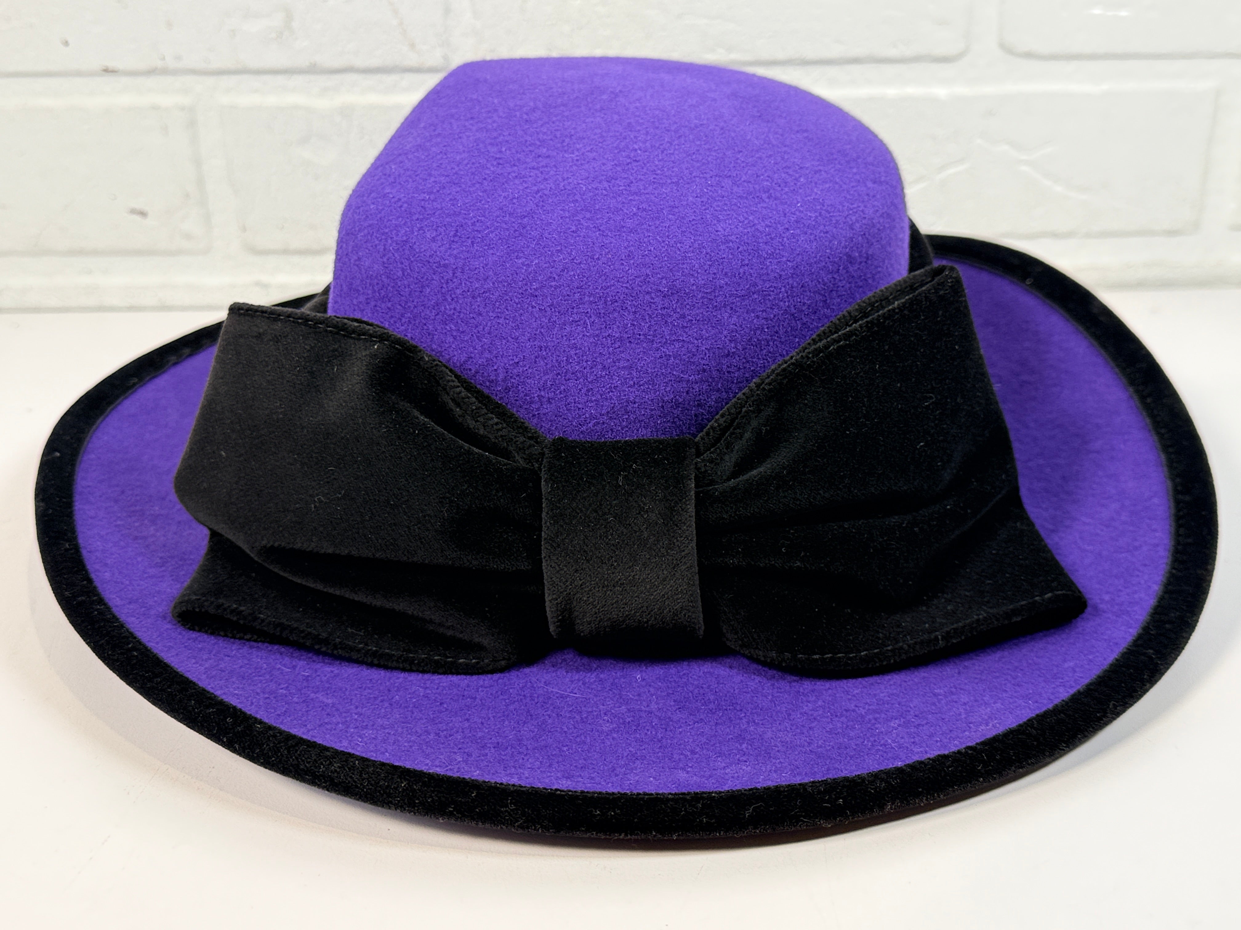 Vintage Alexon purple wool felt hat made in England with black velvet trim and bow. Elegant statement wide brim ladies formal occasion hat.