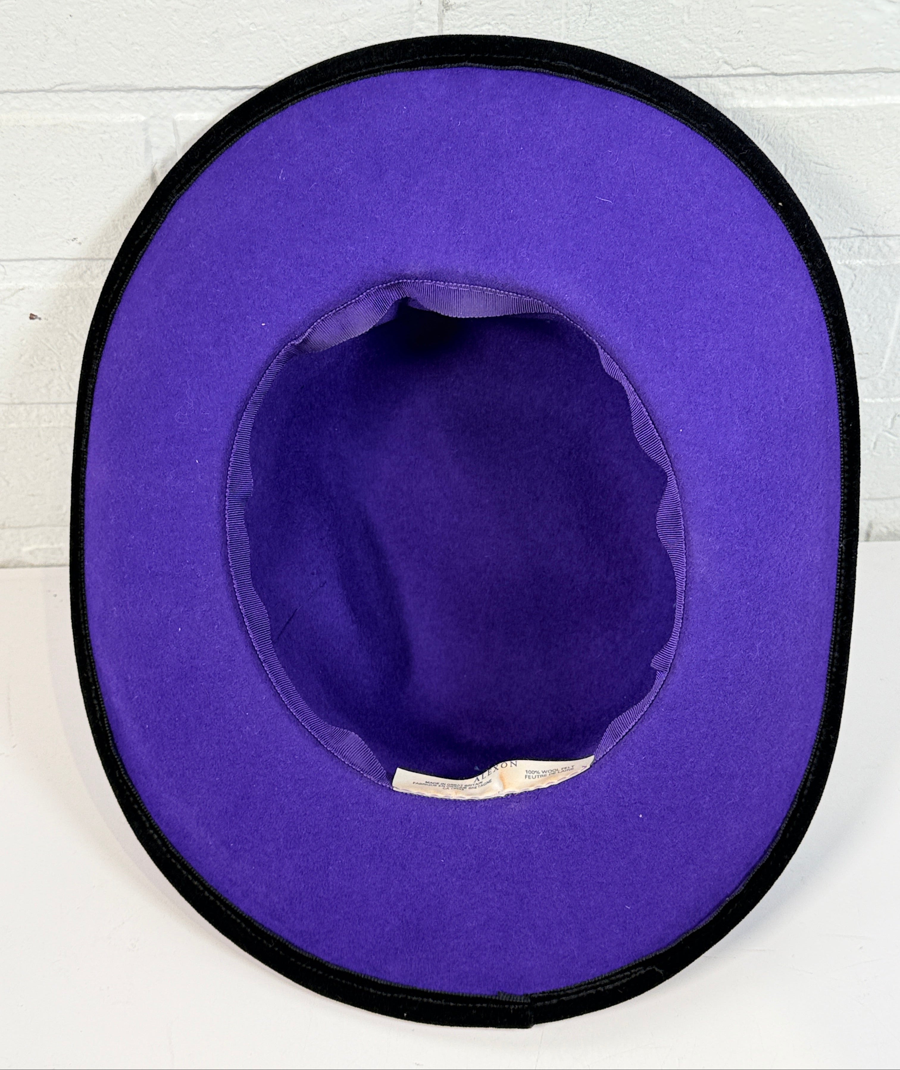Vintage Alexon purple wool felt hat made in England with black velvet trim and bow. Elegant statement wide brim ladies formal occasion hat.