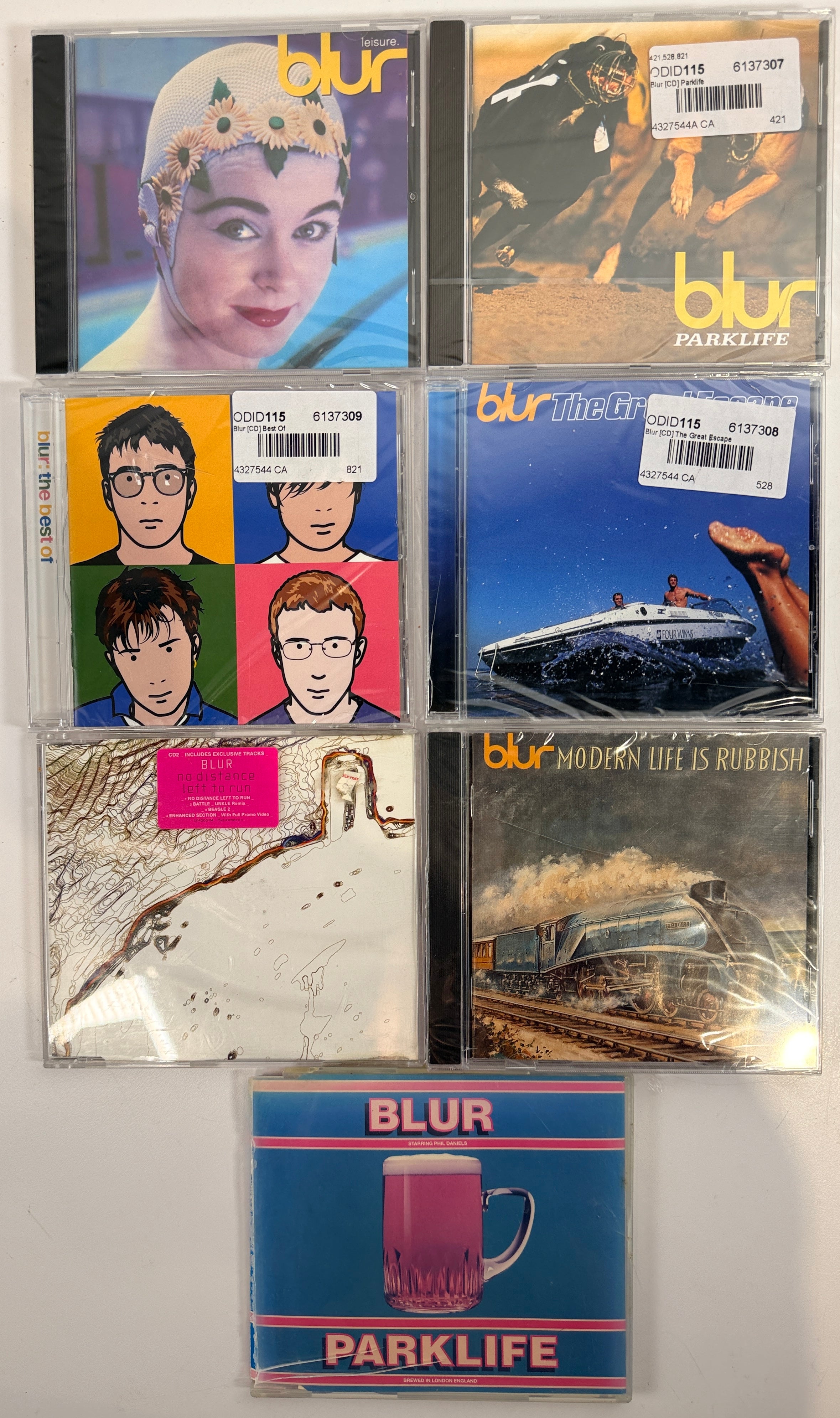 Blur CD lot with 7 albums and singles including Parklife, Leisure, Great Escape and more. Classic Britpop collection in used condition.