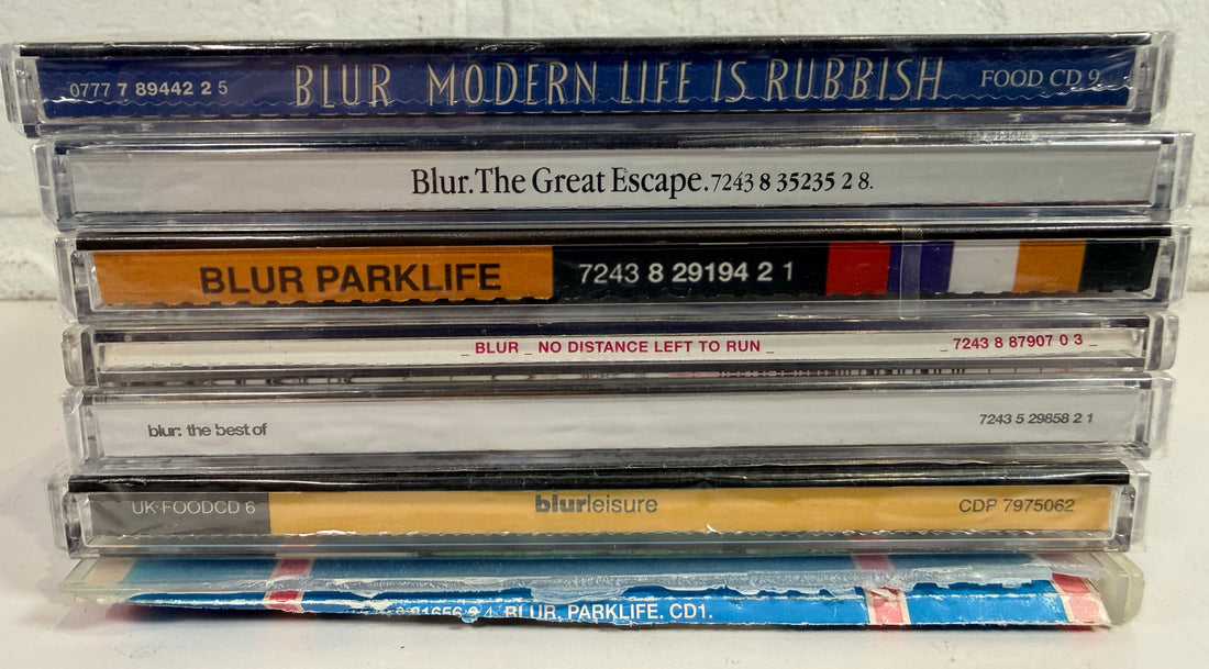 Blur CD lot with 7 albums and singles including Parklife, Leisure, Great Escape and more. Classic Britpop collection in used condition.