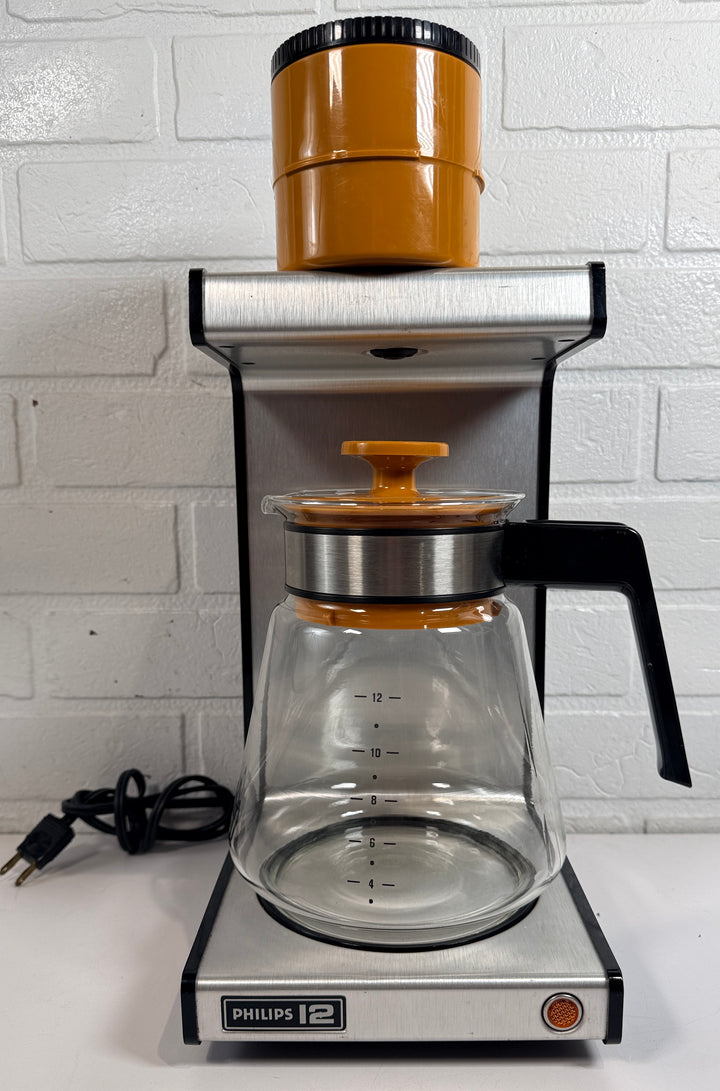  Vintage Philips 12 orange coffee maker with original carafe. Retro 1970s Dutch drip brewer in iconic industrial design styling