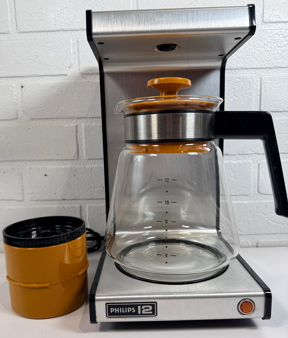  Vintage Philips 12 orange coffee maker with original carafe. Retro 1970s Dutch drip brewer in iconic industrial design styling