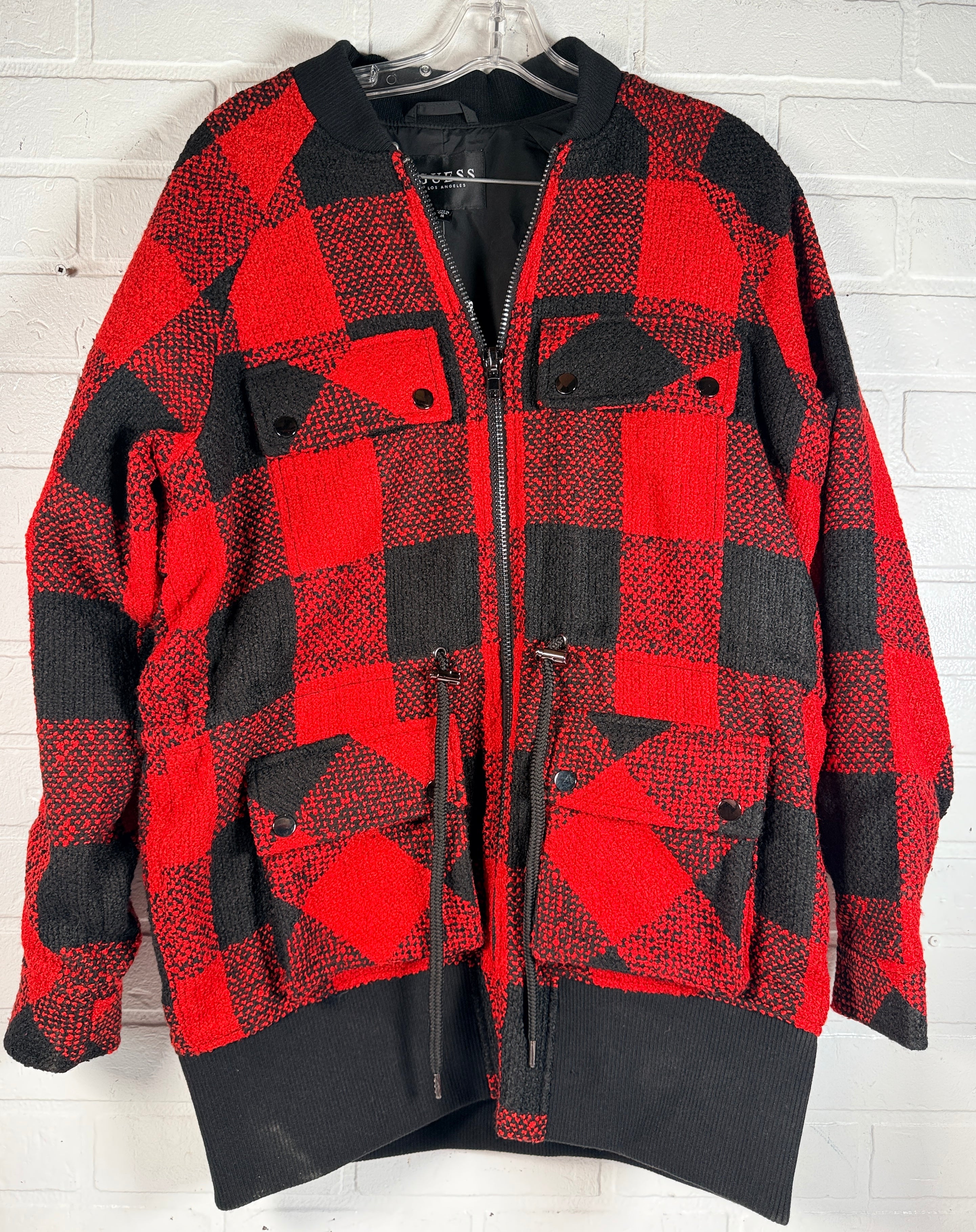 Guess Darian plaid bomber jacket in fiery red buffalo check, size medium, new with tags. Stylish zip front jacket with cargo pockets and bold streetwear look.