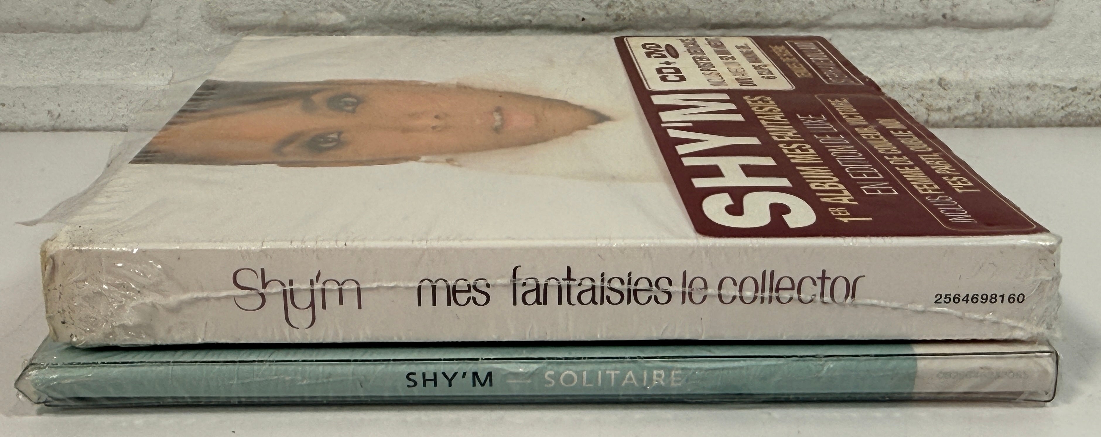 Shy’m sealed CD DVD lot featuring Solitaire and Mes Fantaisies deluxe French pop collector editions.