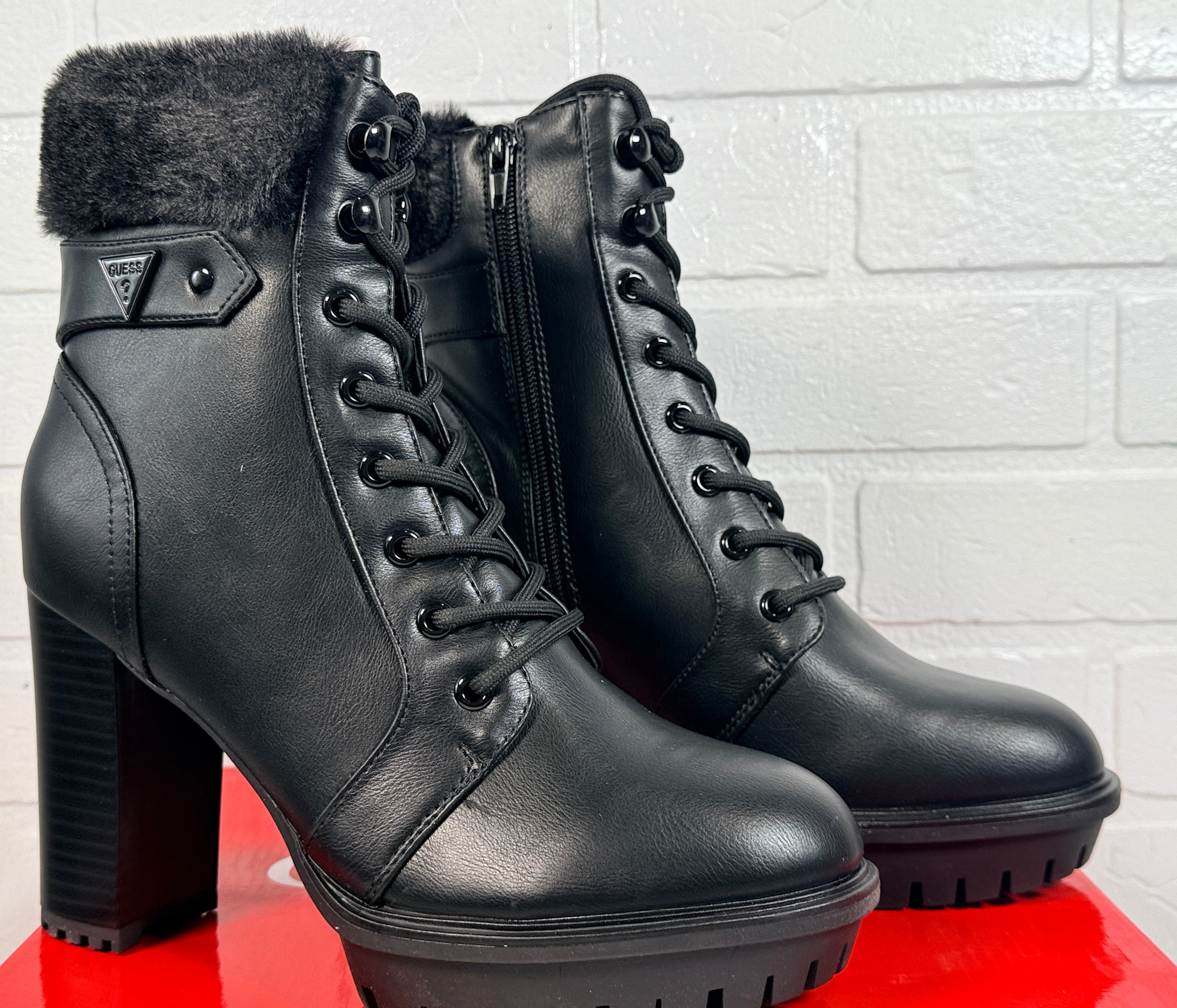 GUESS black platform ankle boots with faux fur trim, lace-up front, side zip and chunky heel. New in box designer women’s fashion boots.