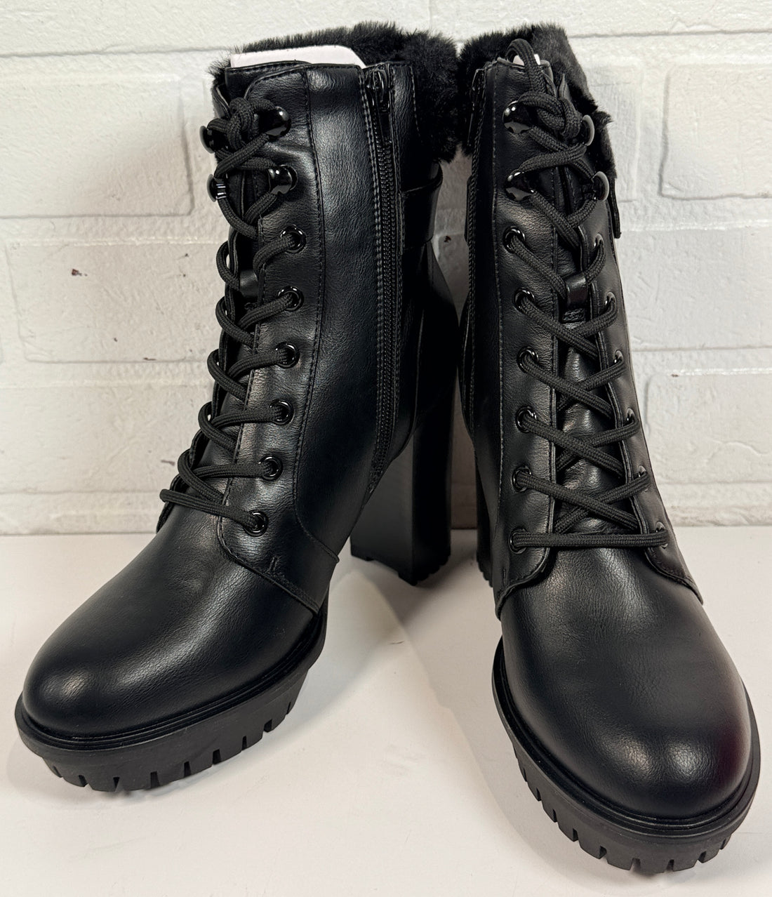GUESS black platform ankle boots with faux fur trim, lace-up front, side zip and chunky heel. New in box designer women’s fashion boots.