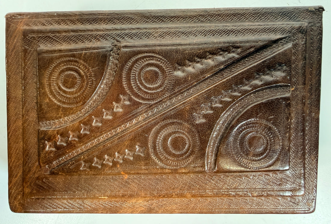 Vintage leather covered wooden box with hand tooled geometric design. Rustic keepsake jewelry storage box with removable lid and handmade charm.