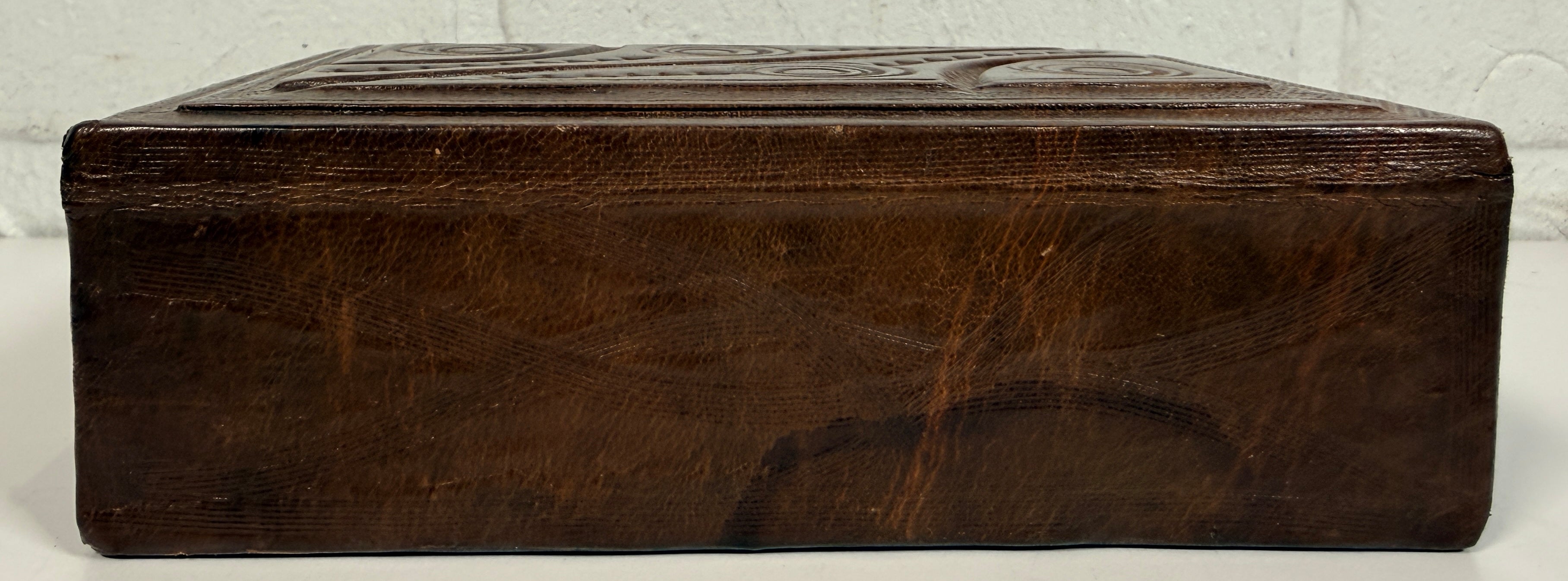 Vintage leather covered wooden box with hand tooled geometric design. Rustic keepsake jewelry storage box with removable lid and handmade charm.