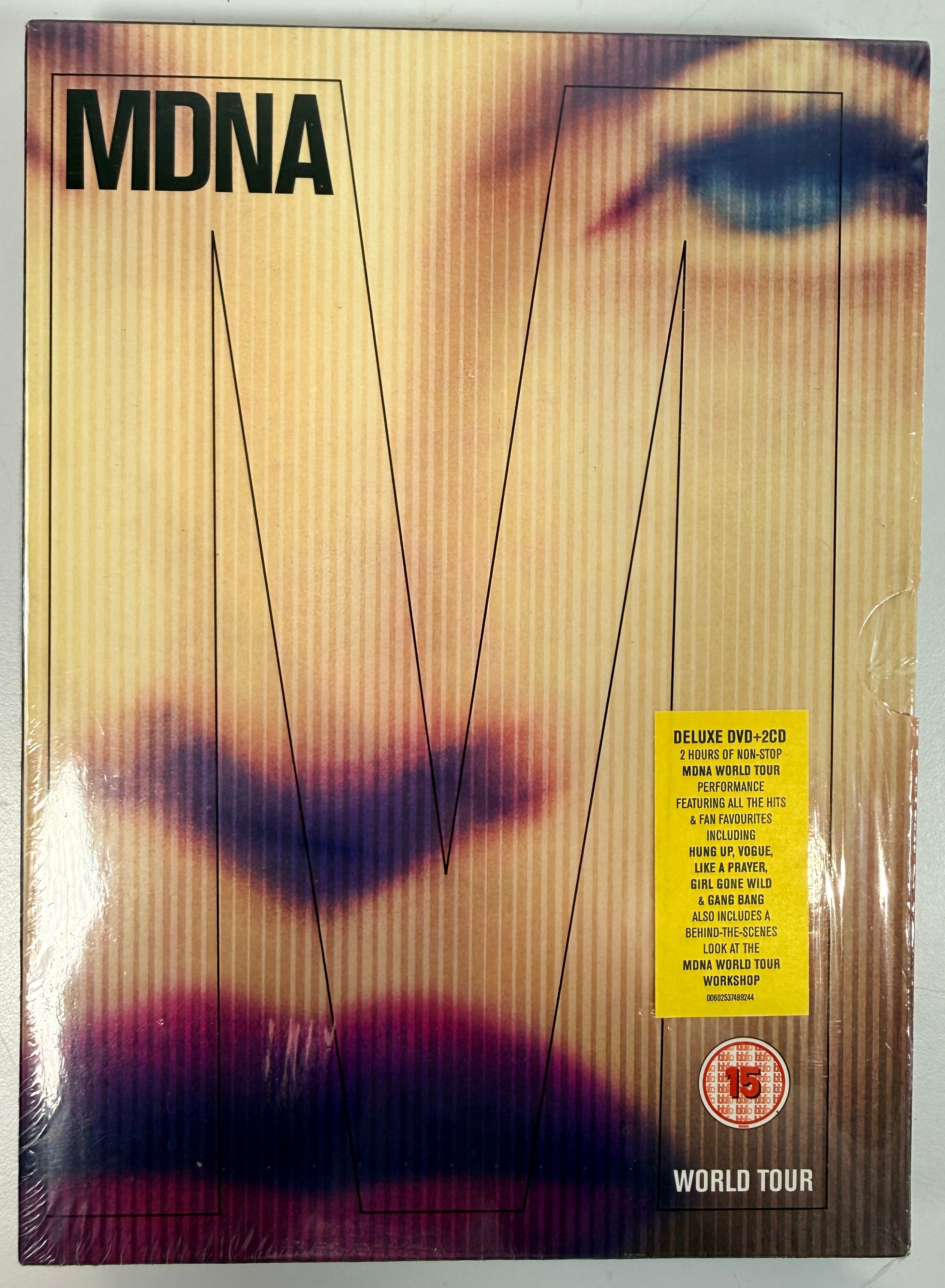 Madonna MDNA World Tour deluxe DVD + 2CD set with collector digipak packaging. Complete live concert edition with bonus content and worldwide region DVD.