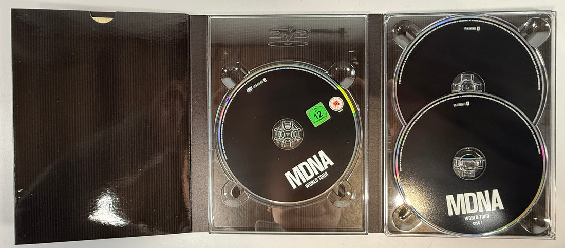 Madonna MDNA World Tour deluxe DVD + 2CD set with collector digipak packaging. Complete live concert edition with bonus content and worldwide region DVD.