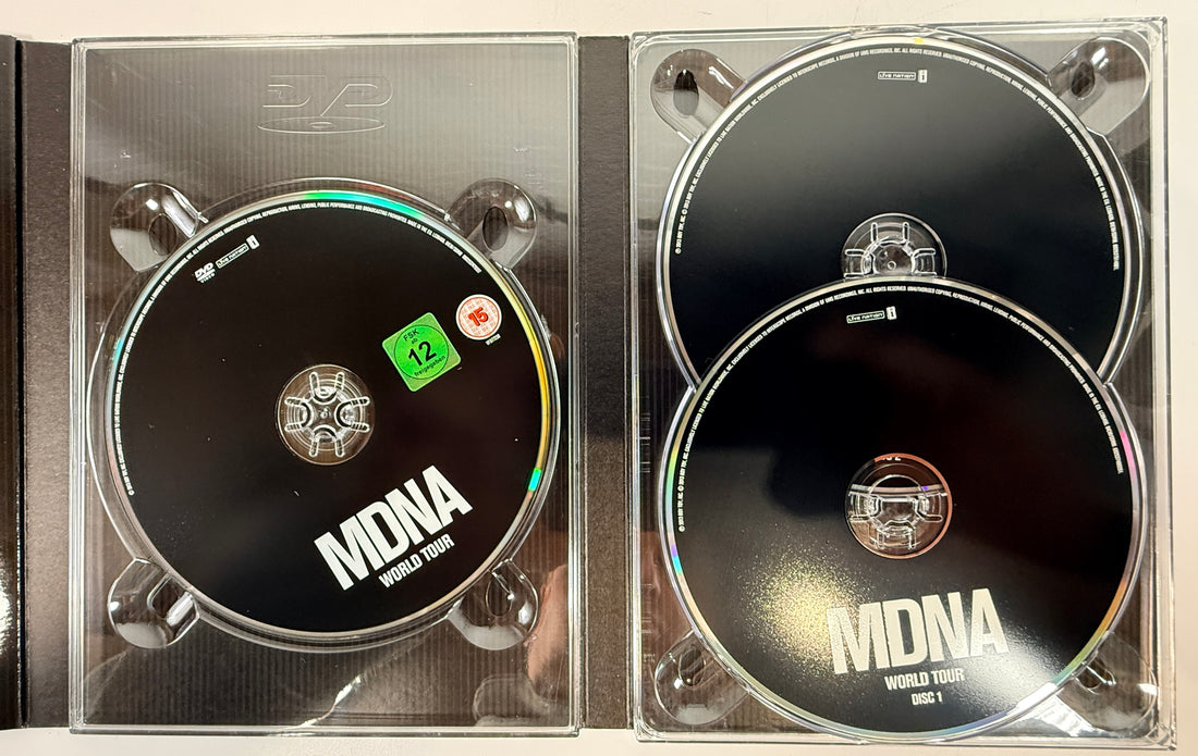 Madonna MDNA World Tour deluxe DVD + 2CD set with collector digipak packaging. Complete live concert edition with bonus content and worldwide region DVD.
