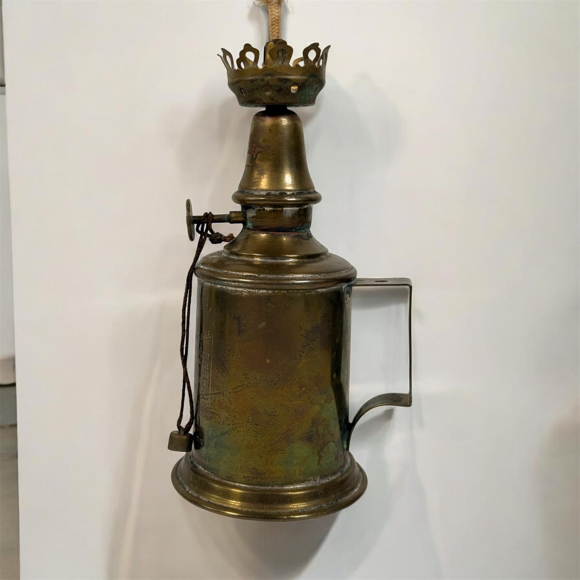 Vintage Lampe Pigeon French safety lamp with brass wall mount body, engraved markings and original patina. Collectible industrial décor display piece.