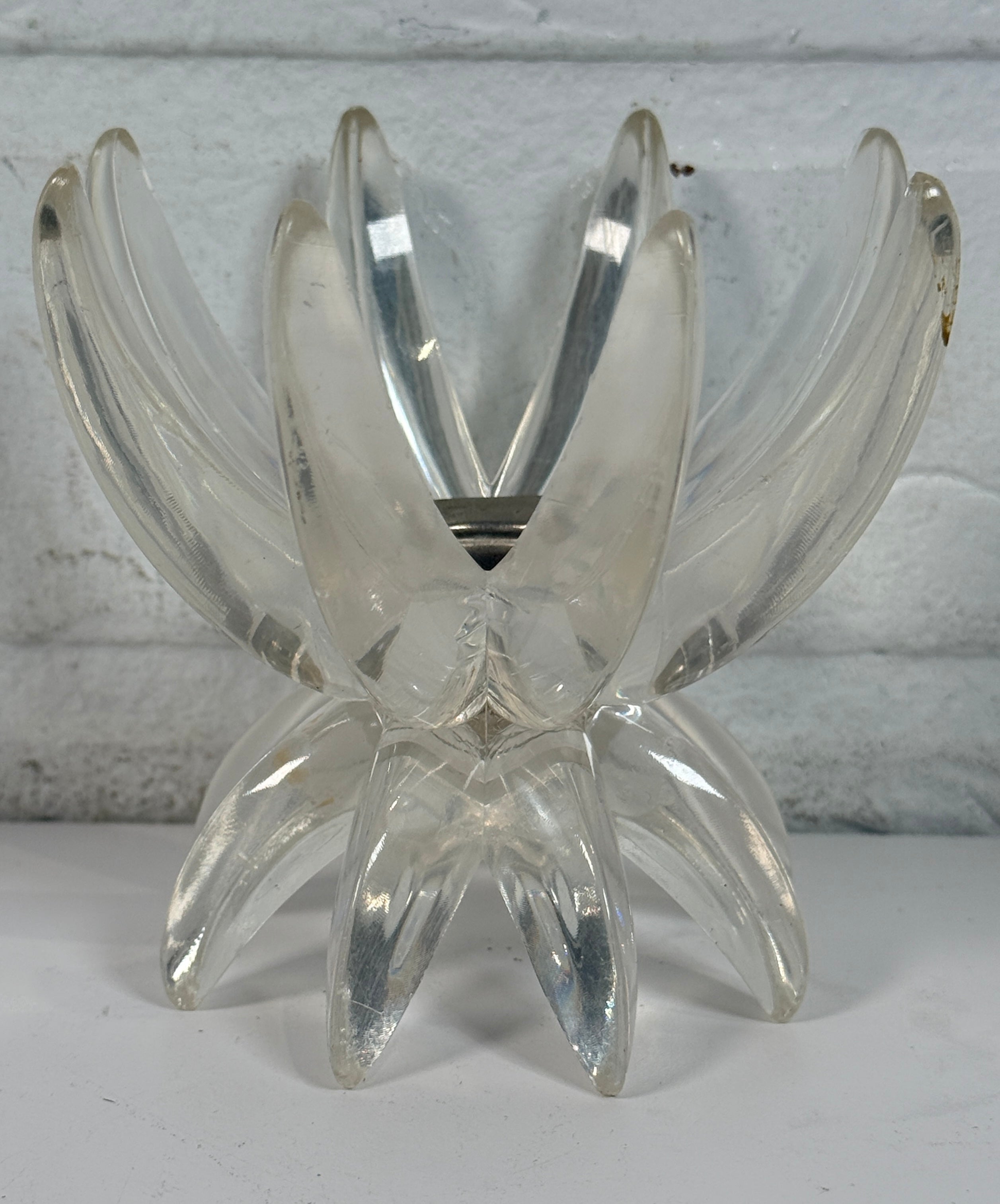 Vintage West German lucite lotus candle holder in clear acrylic. Mid-century floral décor piece with original label and sculptural retro design.
