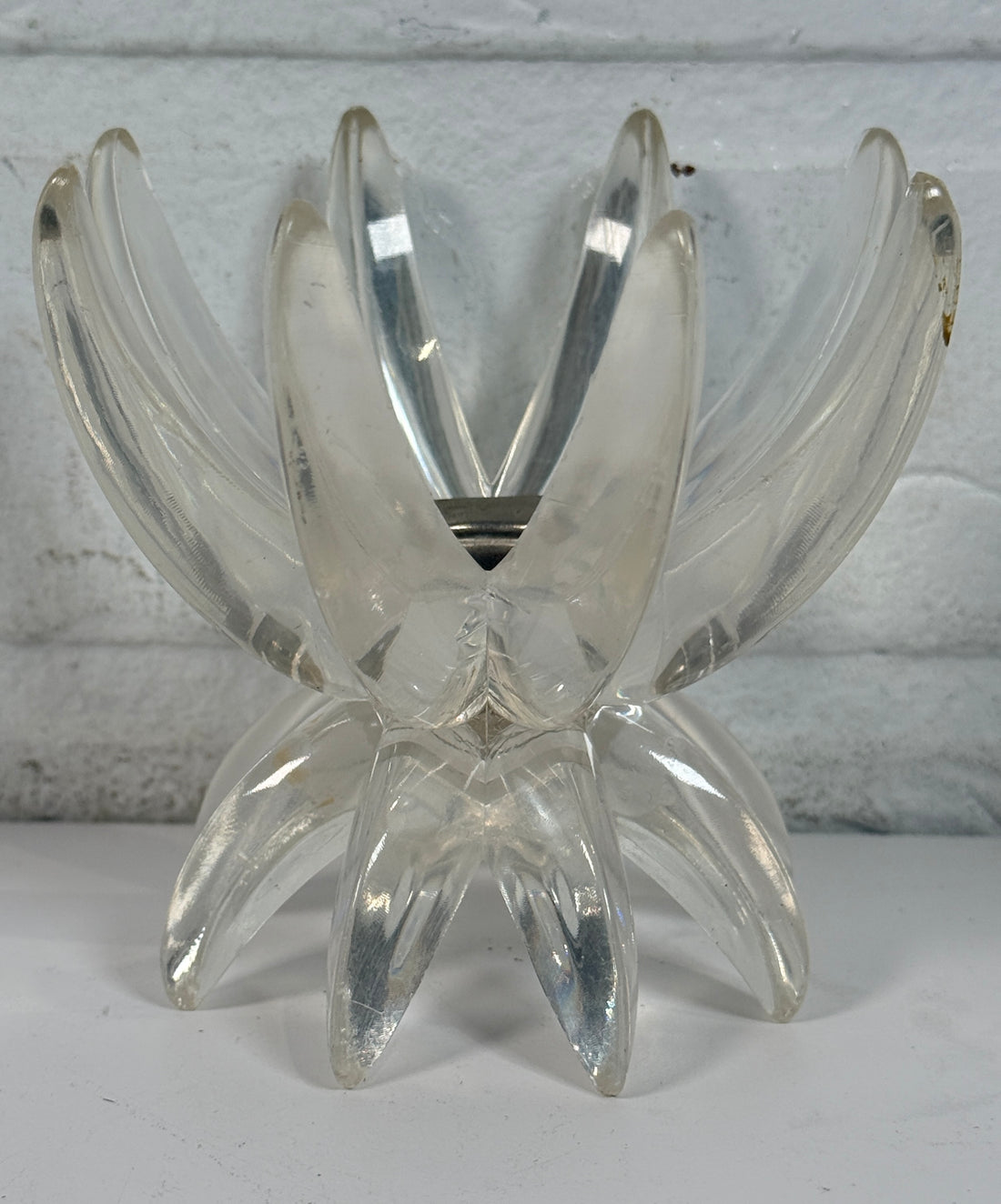 Vintage West German lucite lotus candle holder in clear acrylic. Mid-century floral décor piece with original label and sculptural retro design.