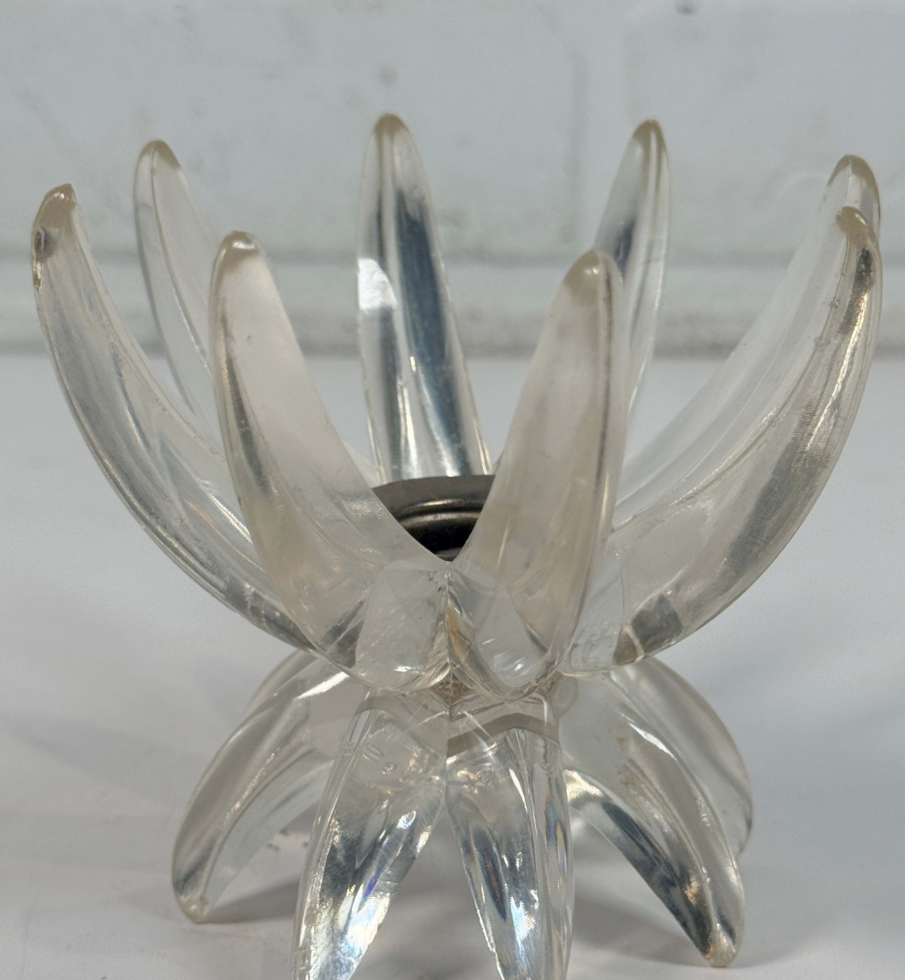 Vintage West German lucite lotus candle holder in clear acrylic. Mid-century floral décor piece with original label and sculptural retro design.