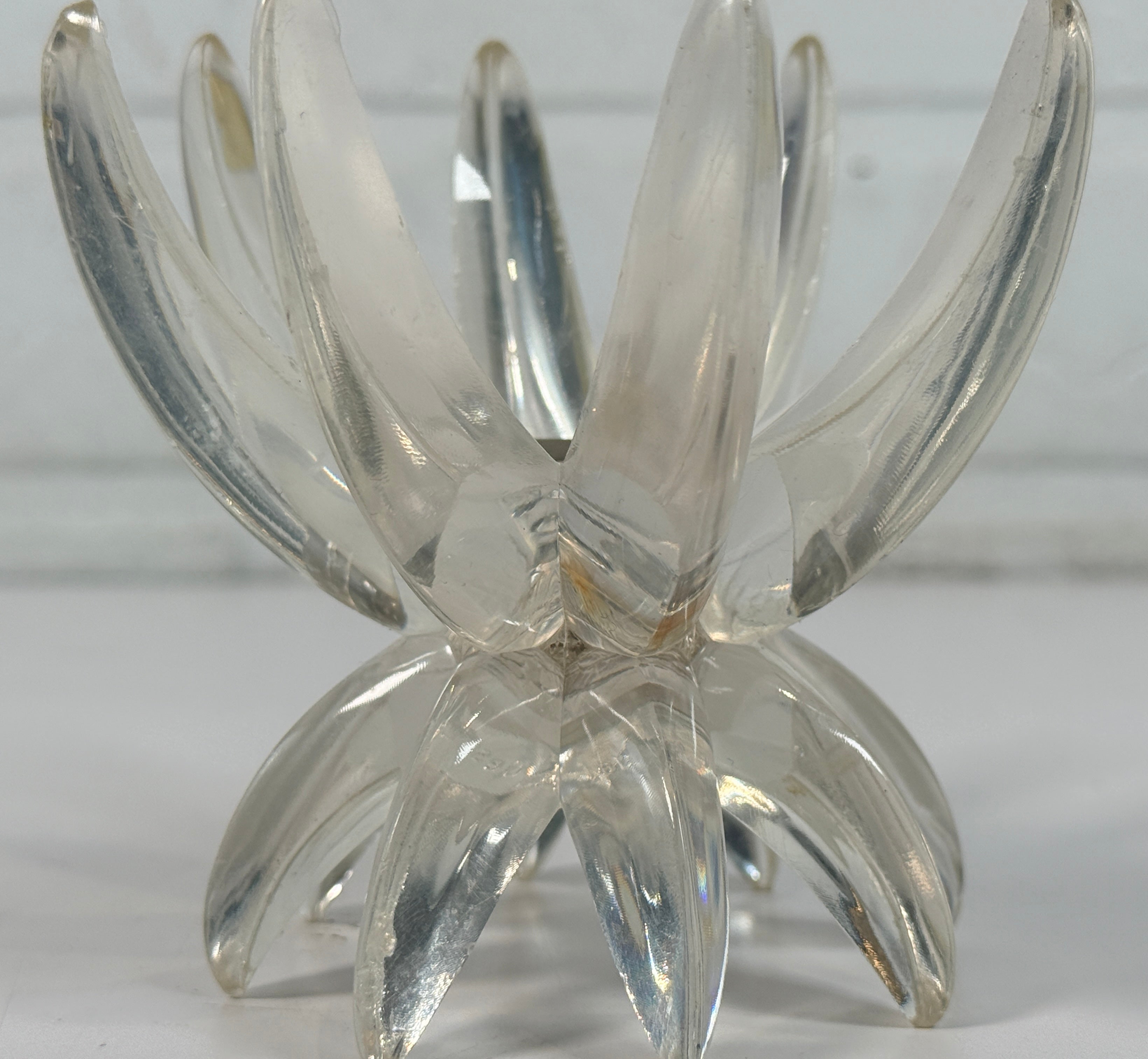 Vintage West German lucite lotus candle holder in clear acrylic. Mid-century floral décor piece with original label and sculptural retro design.