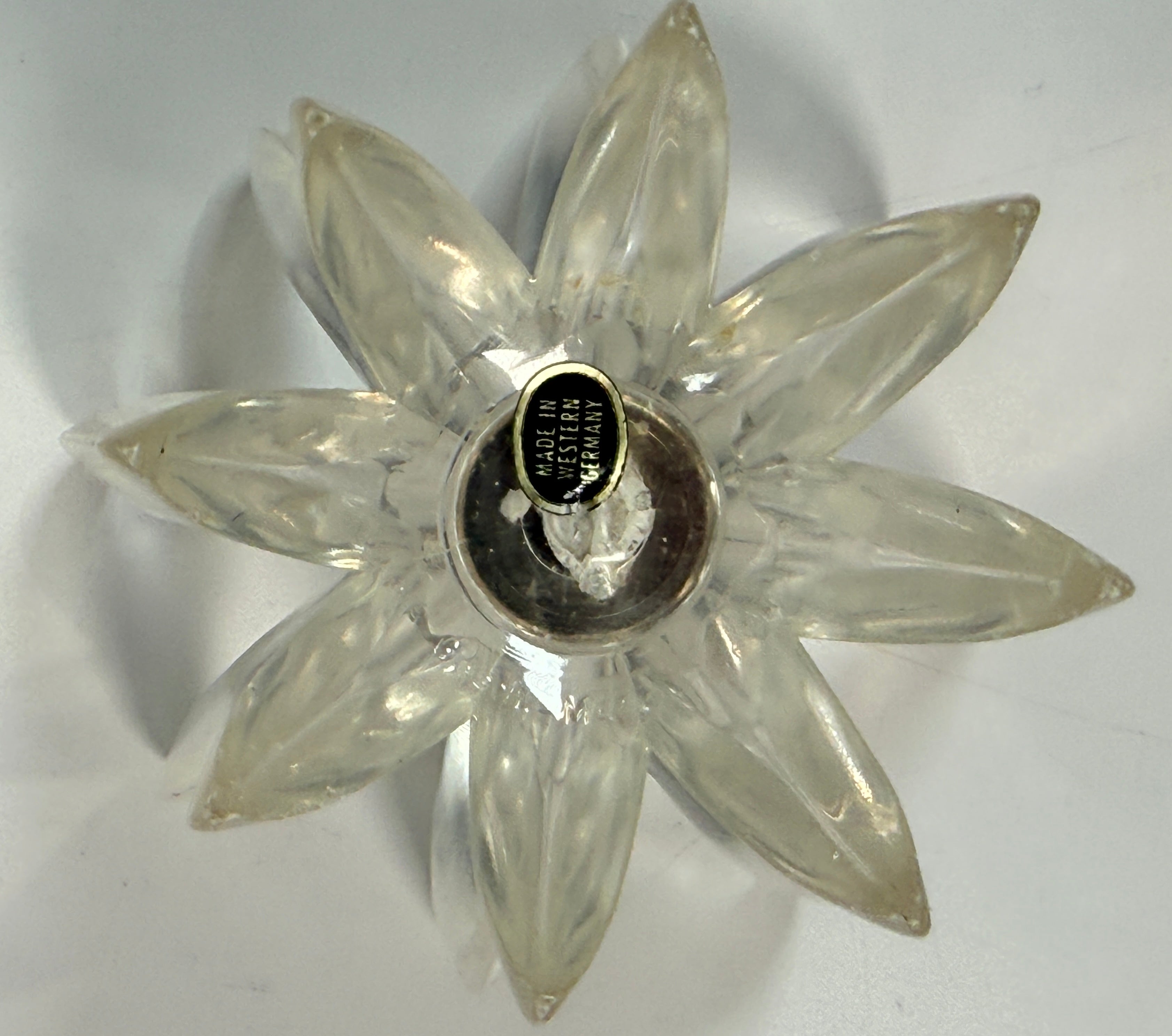Vintage West German lucite lotus candle holder in clear acrylic. Mid-century floral décor piece with original label and sculptural retro design.