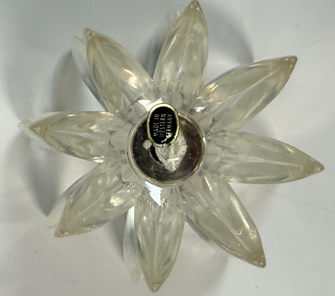 Vintage West German lucite lotus candle holder in clear acrylic. Mid-century floral décor piece with original label and sculptural retro design.