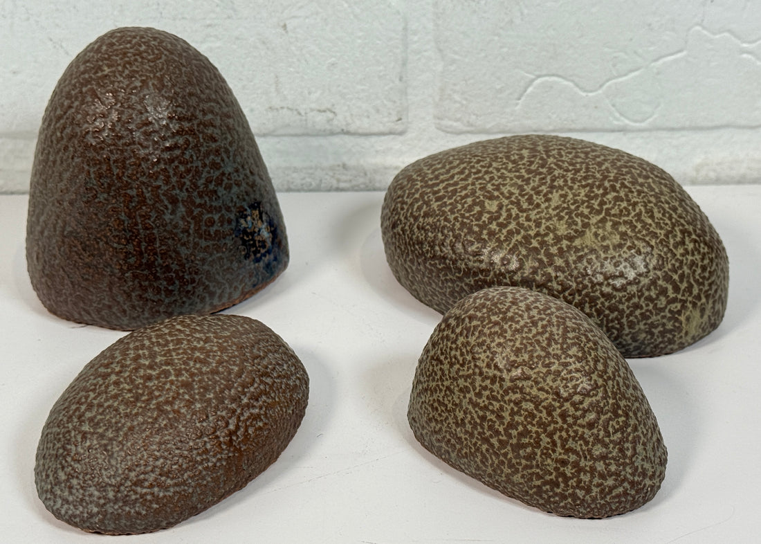 Vintage sculptural nesting pebble vessels set of 4 studio pottery ceramic organic modern brutalist decor art objects collectible display pieces.