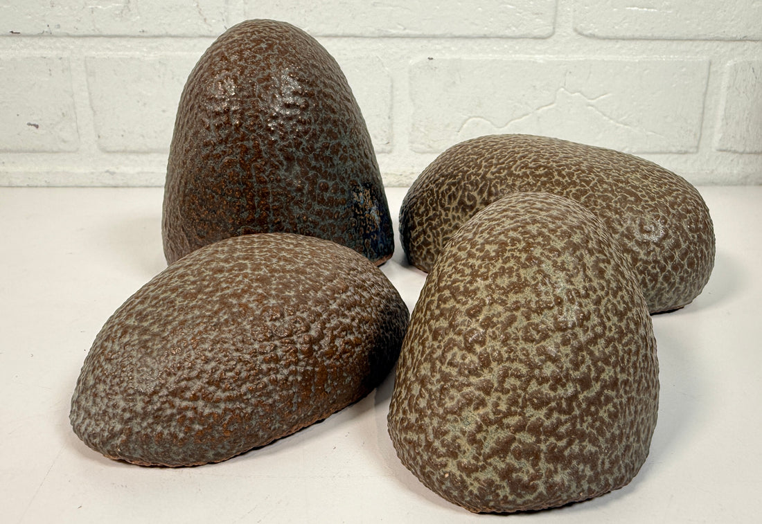 Vintage sculptural nesting pebble vessels set of 4 studio pottery ceramic organic modern brutalist decor art objects collectible display pieces.