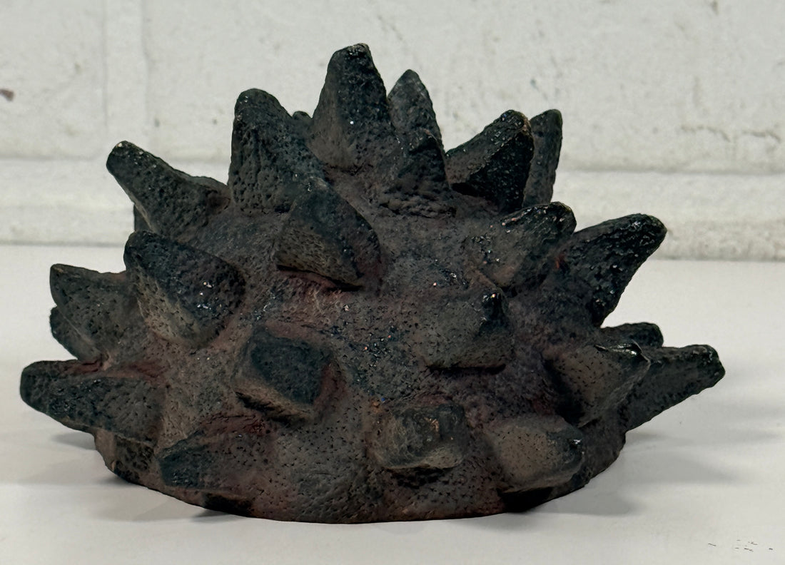 Vintage Brutalist studio pottery bowl with spiked sea urchin form, textured black exterior and glazed interior. Rare sculptural MCM centerpiece décor