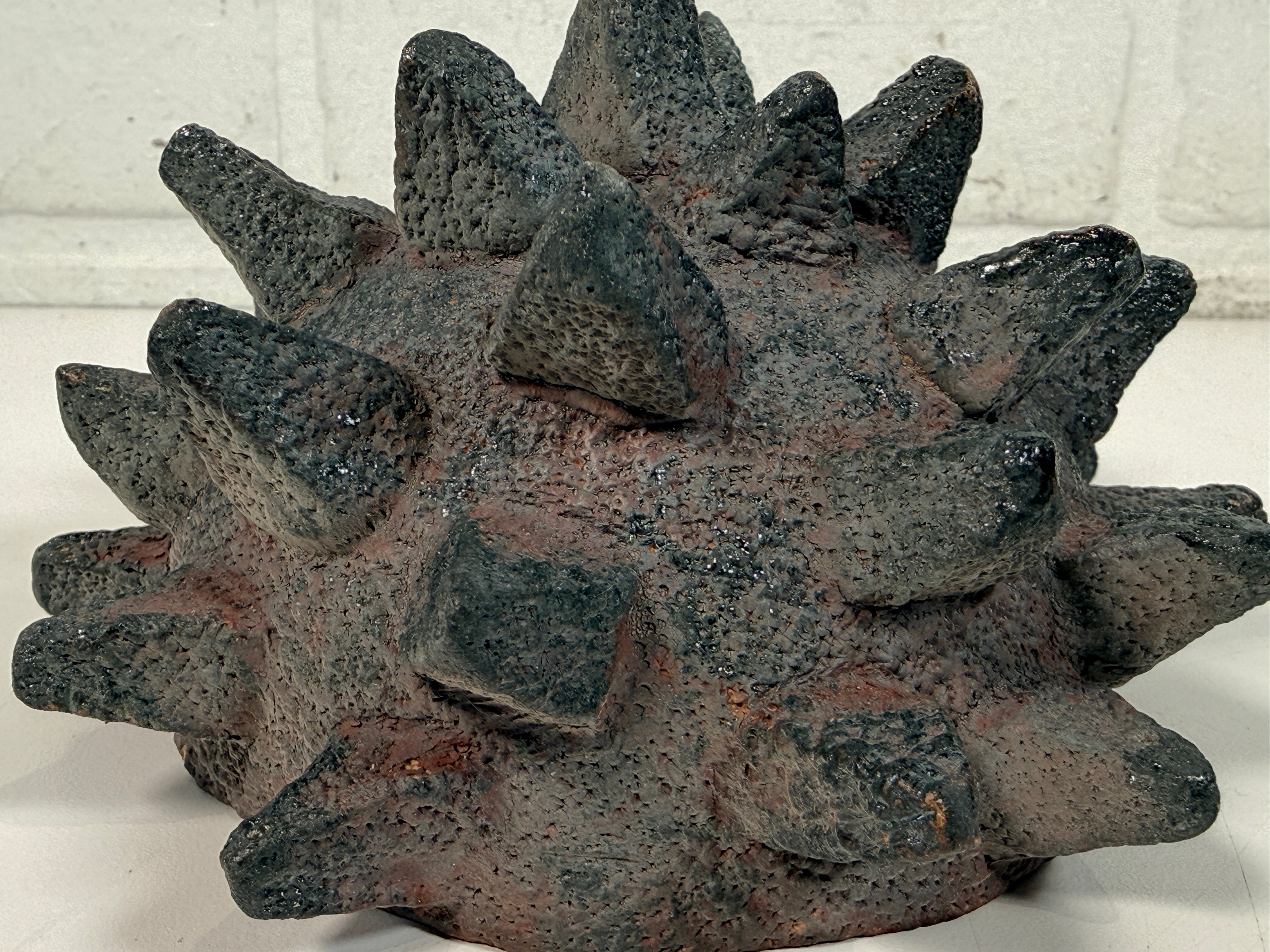 Vintage Brutalist studio pottery bowl with spiked sea urchin form, textured black exterior and glazed interior. Rare sculptural MCM centerpiece décor