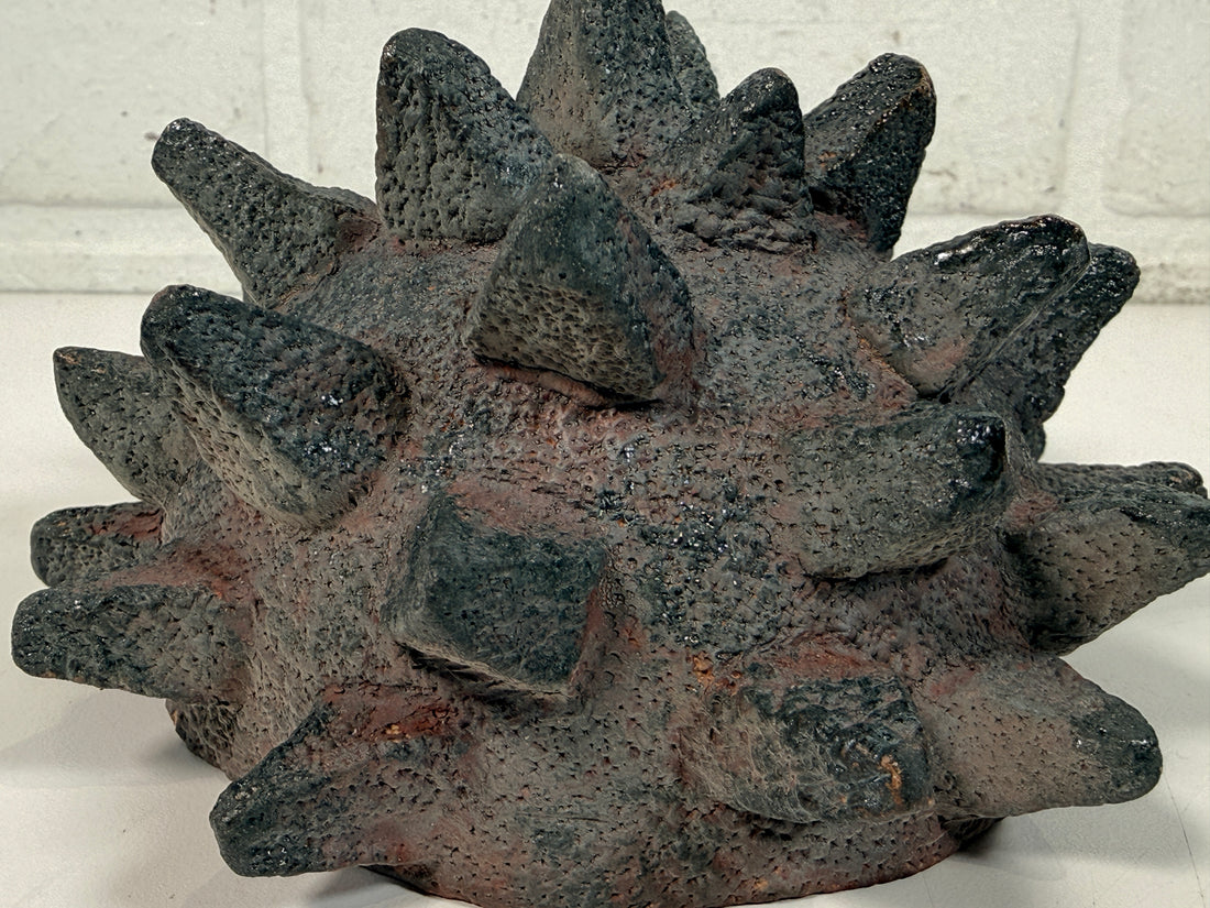 Vintage Brutalist studio pottery bowl with spiked sea urchin form, textured black exterior and glazed interior. Rare sculptural MCM centerpiece décor