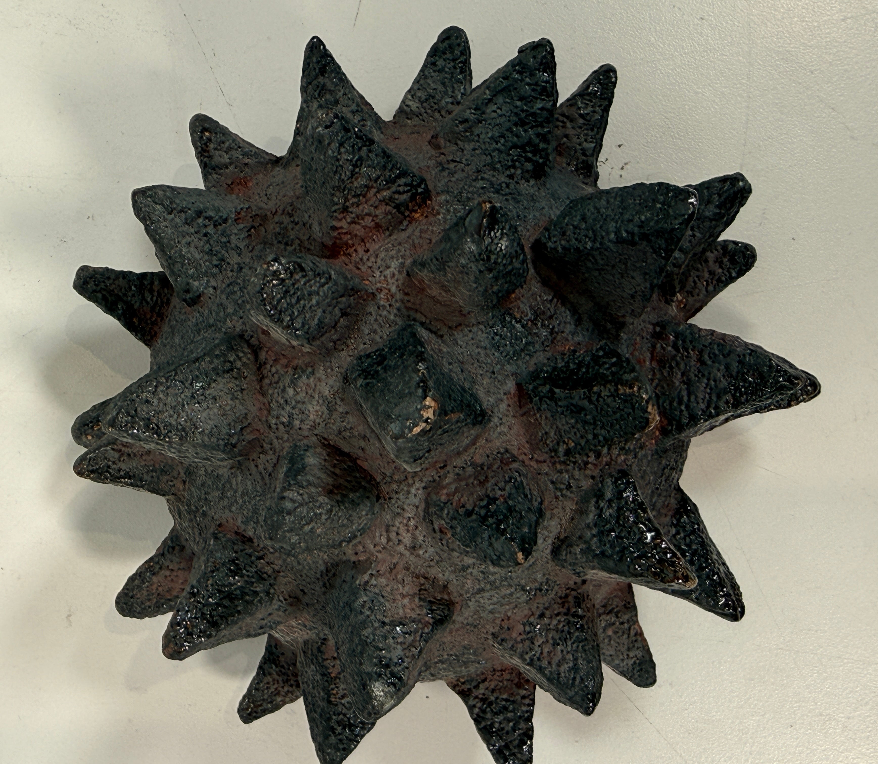 Vintage Brutalist studio pottery bowl with spiked sea urchin form, textured black exterior and glazed interior. Rare sculptural MCM centerpiece décor