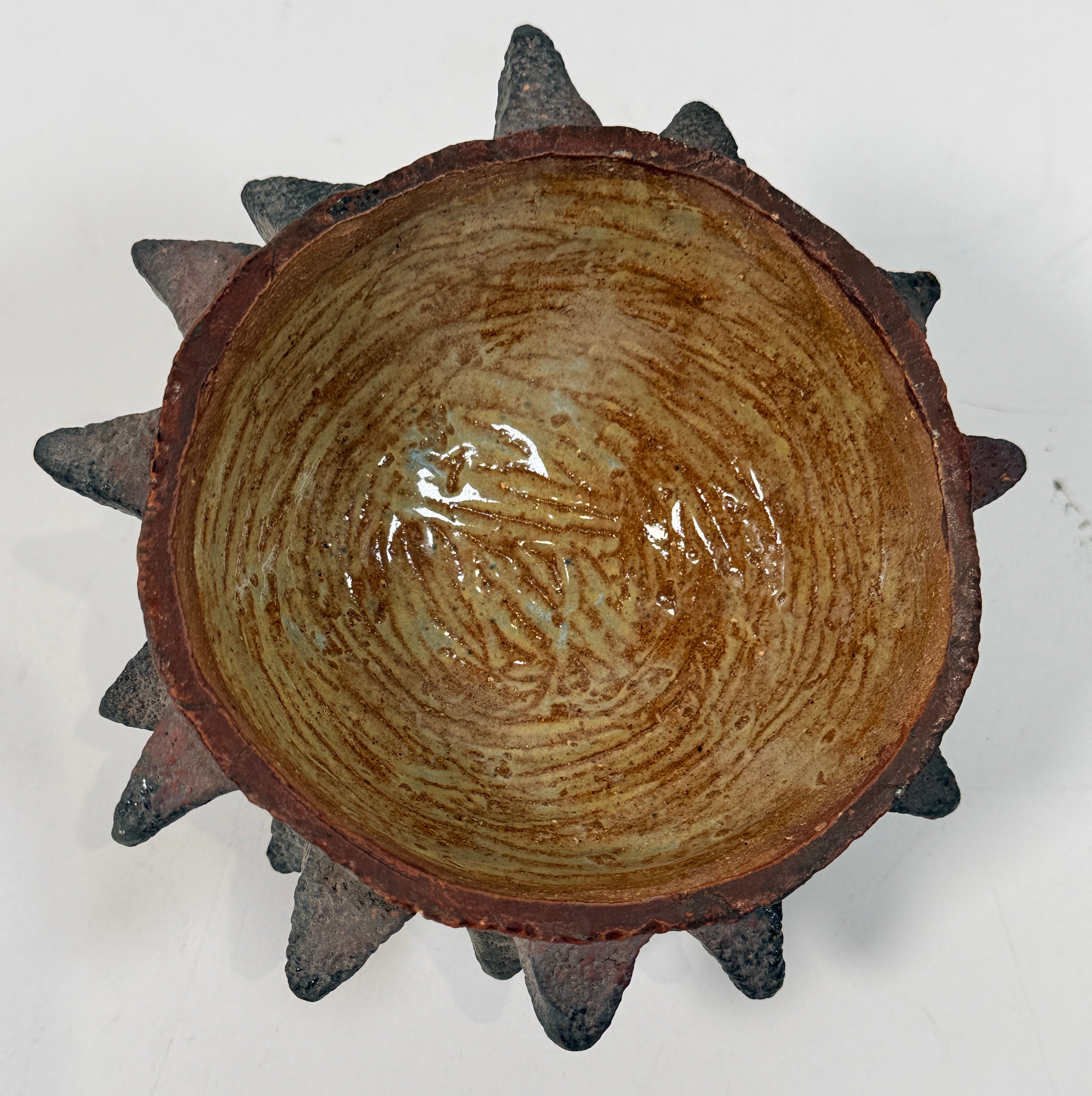 Vintage Brutalist studio pottery bowl with spiked sea urchin form, textured black exterior and glazed interior. Rare sculptural MCM centerpiece décor