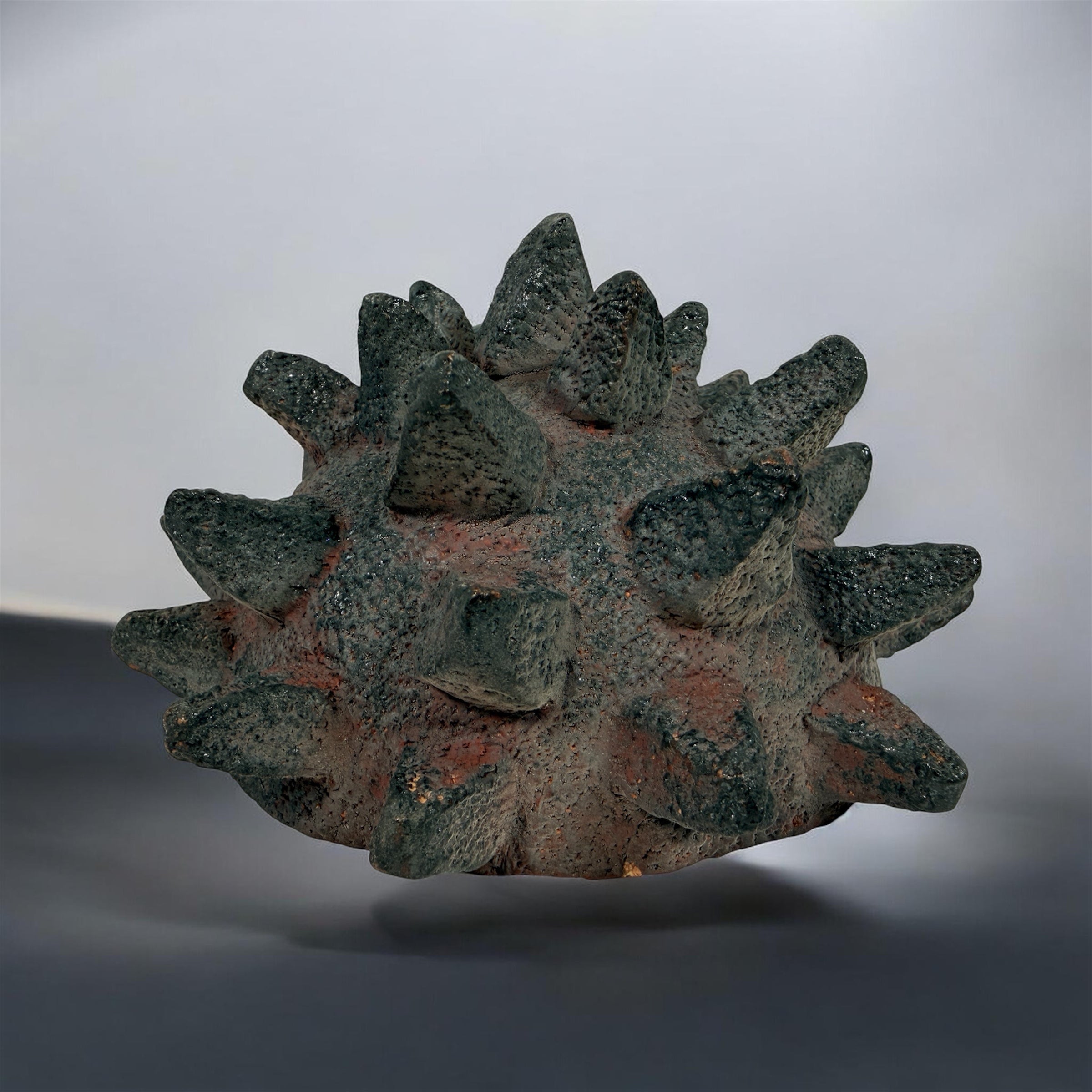 Vintage Brutalist studio pottery bowl with spiked sea urchin form, textured black exterior and glazed interior. Rare sculptural MCM centerpiece décor