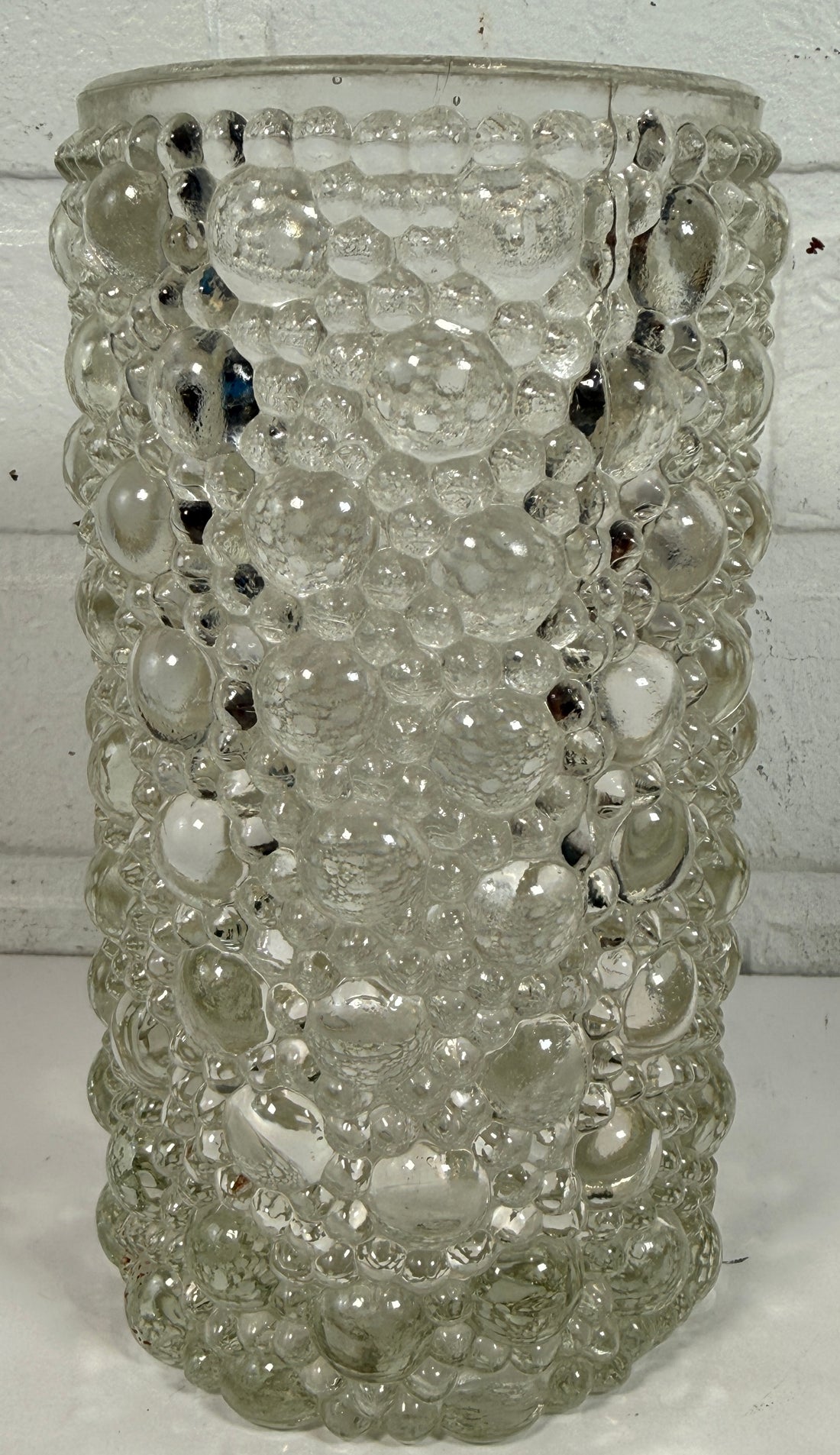 Mid-century modern clear bubble glass cylinder vase with Scandinavian style. Heavy textured art glass décor piece from the 1960s–70s.