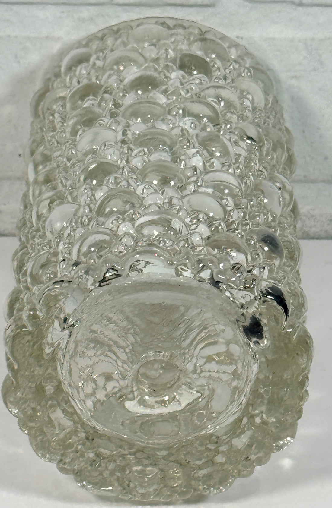 Mid-century modern clear bubble glass cylinder vase with Scandinavian style. Heavy textured art glass décor piece from the 1960s–70s.
